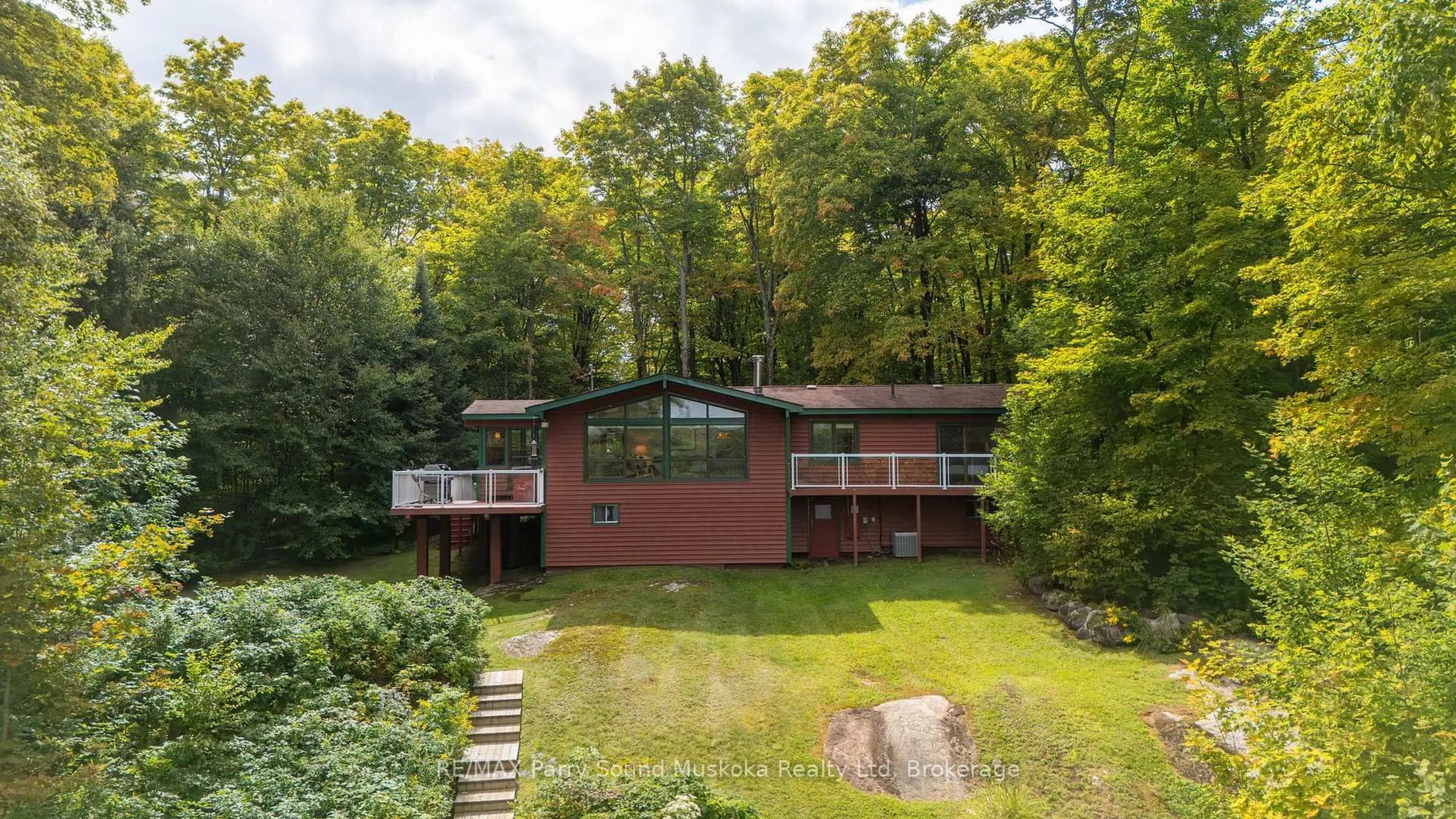A pic from outside/outdoor area/front of a property/back of a property/a pic from drone, forest/trees view for 23 Brown's Lake Rd, Seguin Ontario P2A 2W8