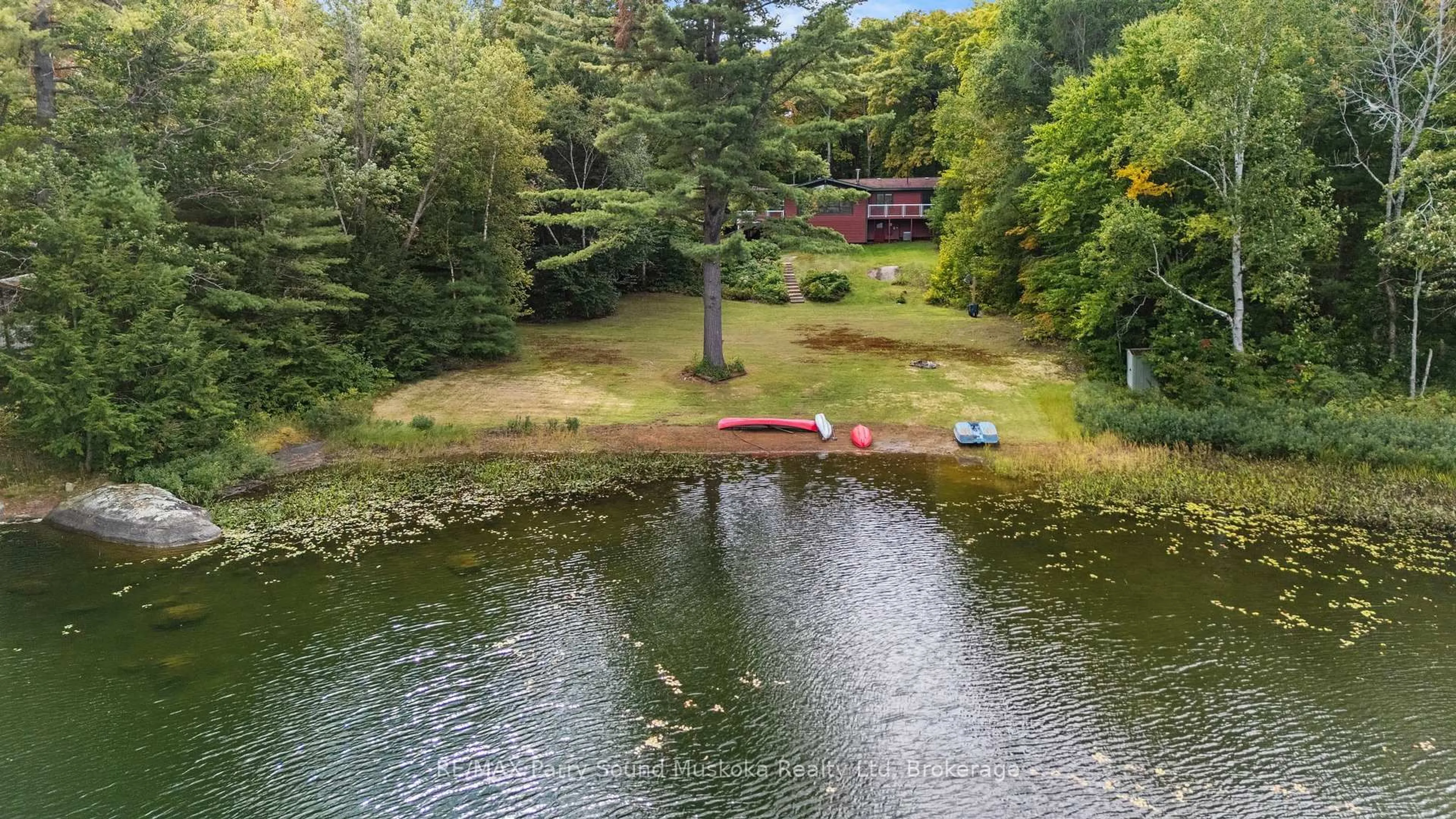 A pic from outside/outdoor area/front of a property/back of a property/a pic from drone, water/lake/river/ocean view for 23 Brown's Lake Rd, Seguin Ontario P2A 2W8