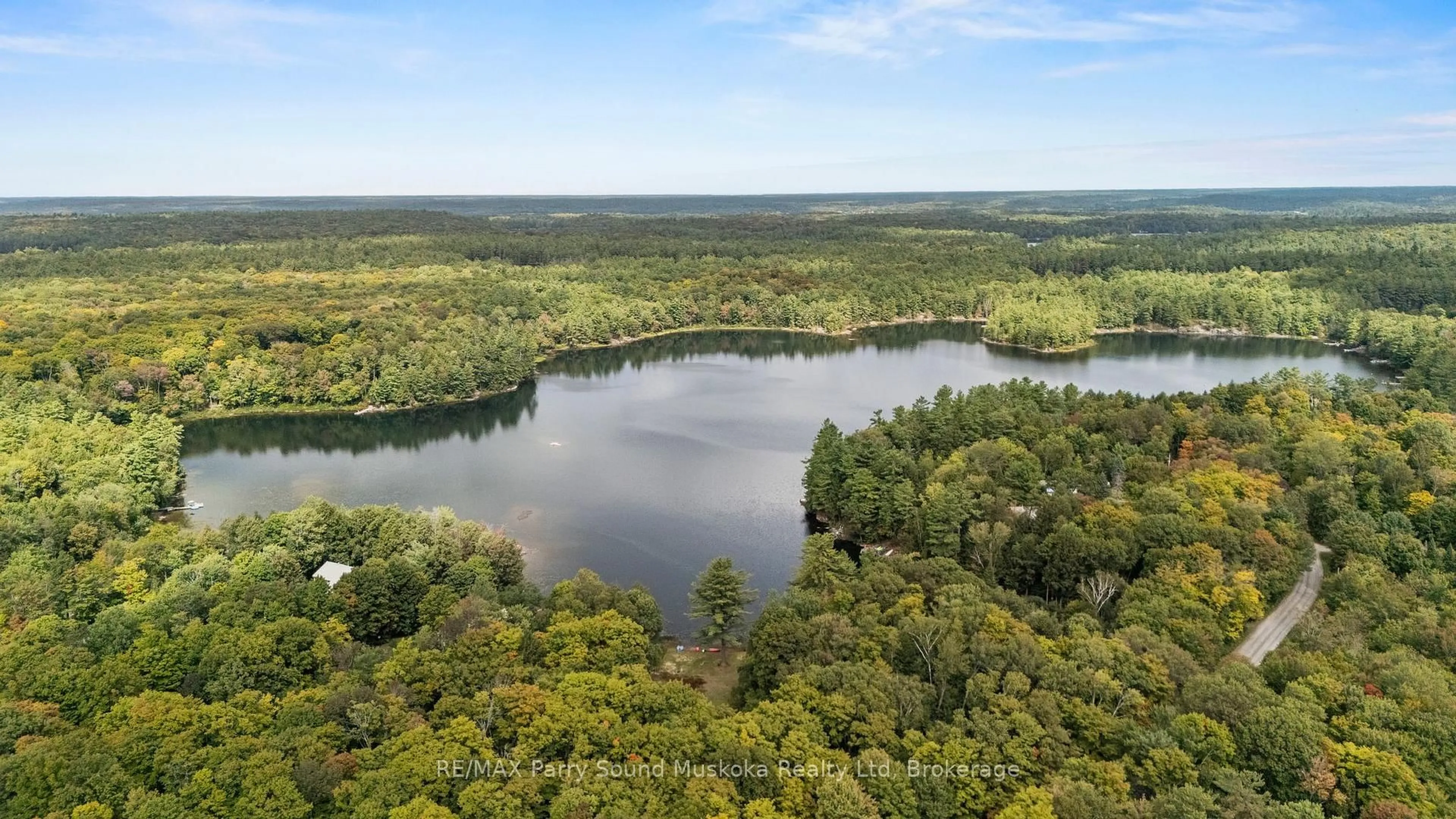 A pic from outside/outdoor area/front of a property/back of a property/a pic from drone, water/lake/river/ocean view for 23 Brown's Lake Rd, Seguin Ontario P2A 2W8