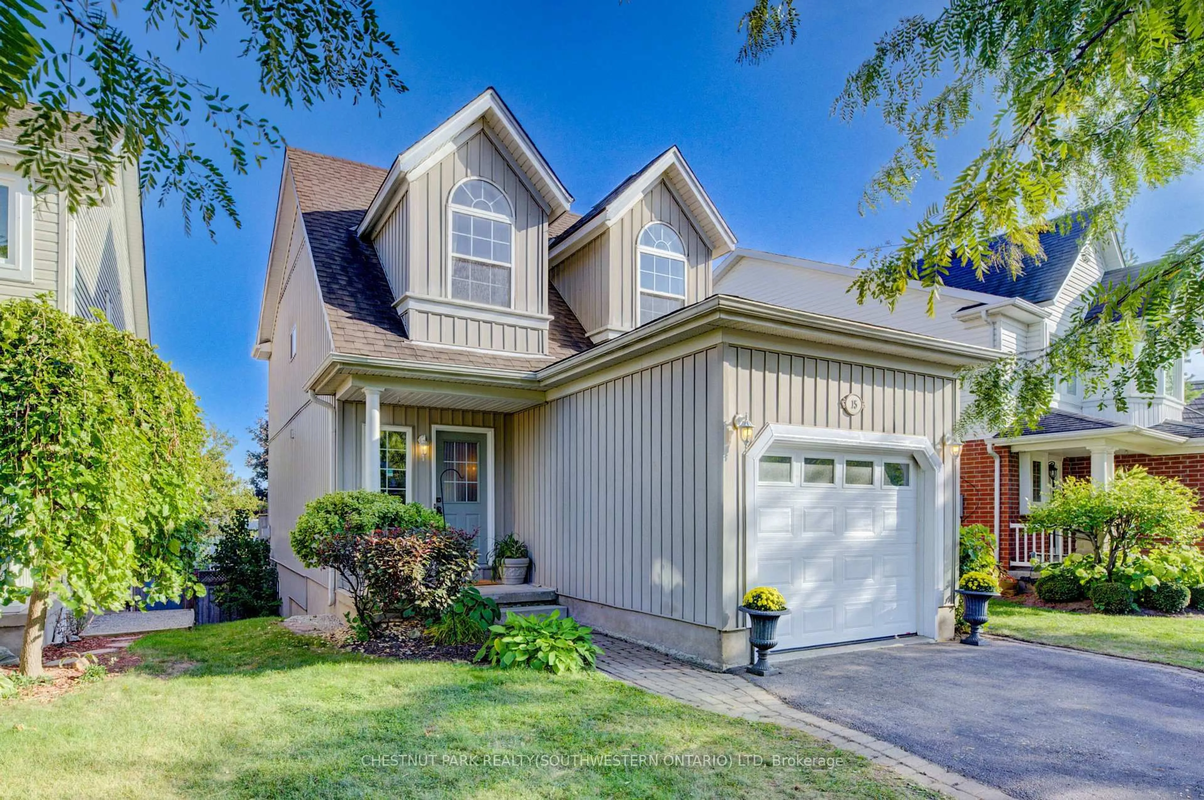 Home with vinyl exterior material, street for 15 Pettitt Dr, Guelph Ontario N1E 7G7