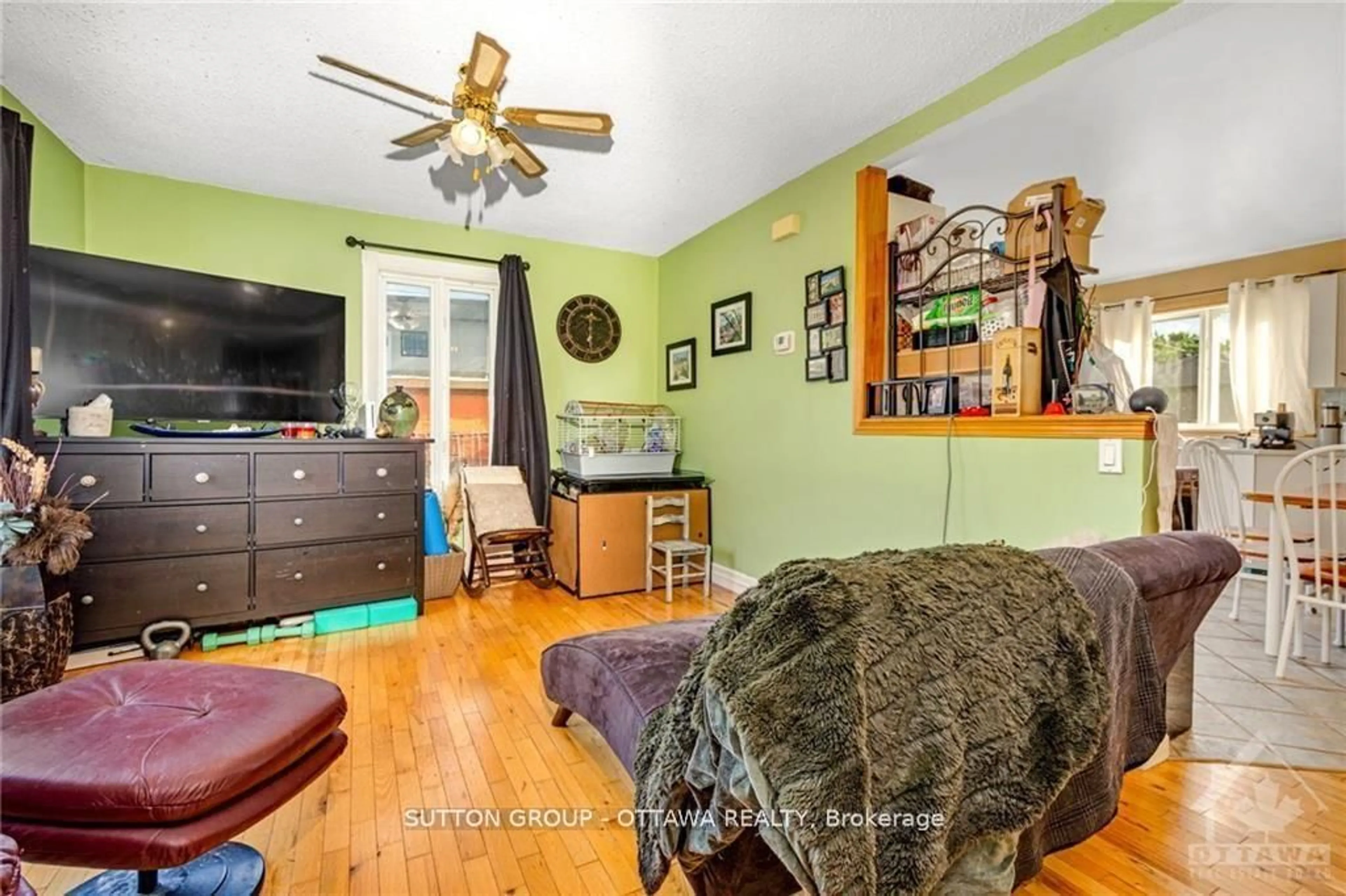 Living room with furniture, wood/laminate floor for 846 St Laurent Blvd, Ottawa Ontario K1K 3A9