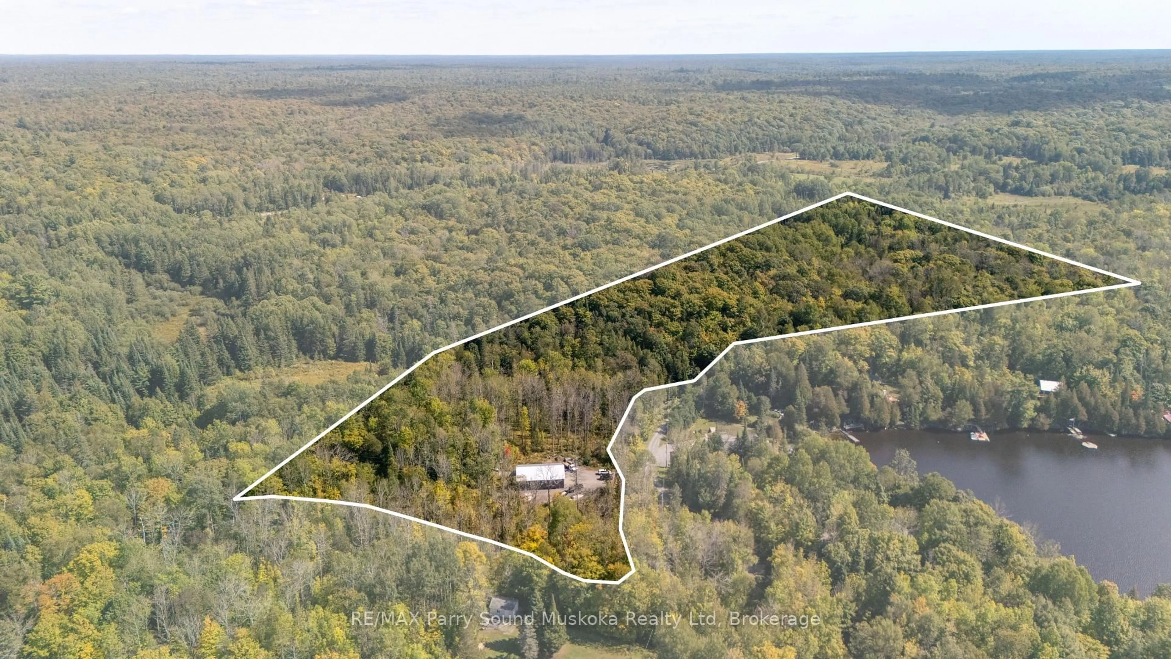 A pic from outside/outdoor area/front of a property/back of a property/a pic from drone, forest/trees view for 40 Sunset Cove Rd, Seguin Ontario P2A 0B6