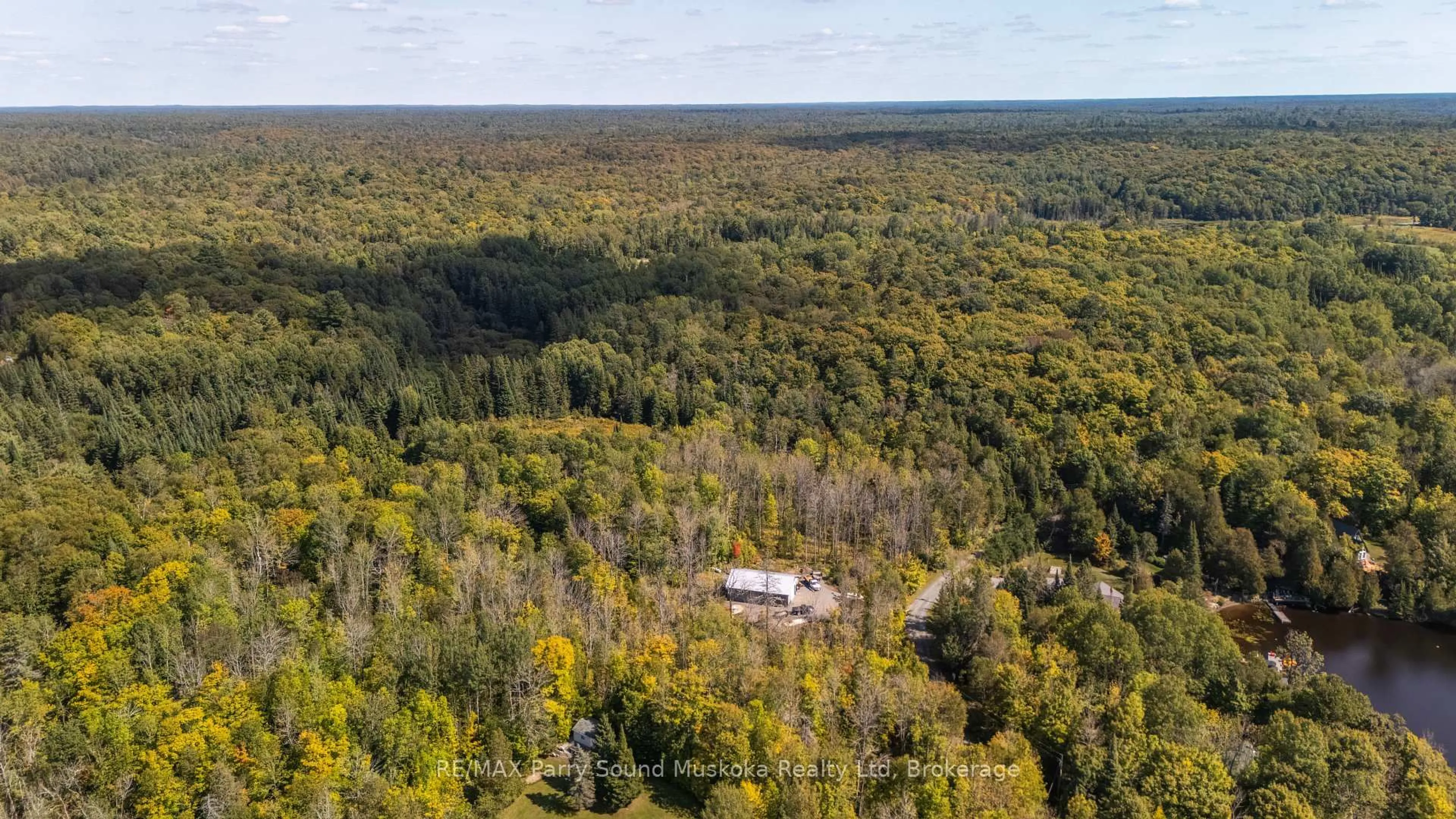 A pic from outside/outdoor area/front of a property/back of a property/a pic from drone, forest/trees view for 40 Sunset Cove Rd, Seguin Ontario P2A 0B6