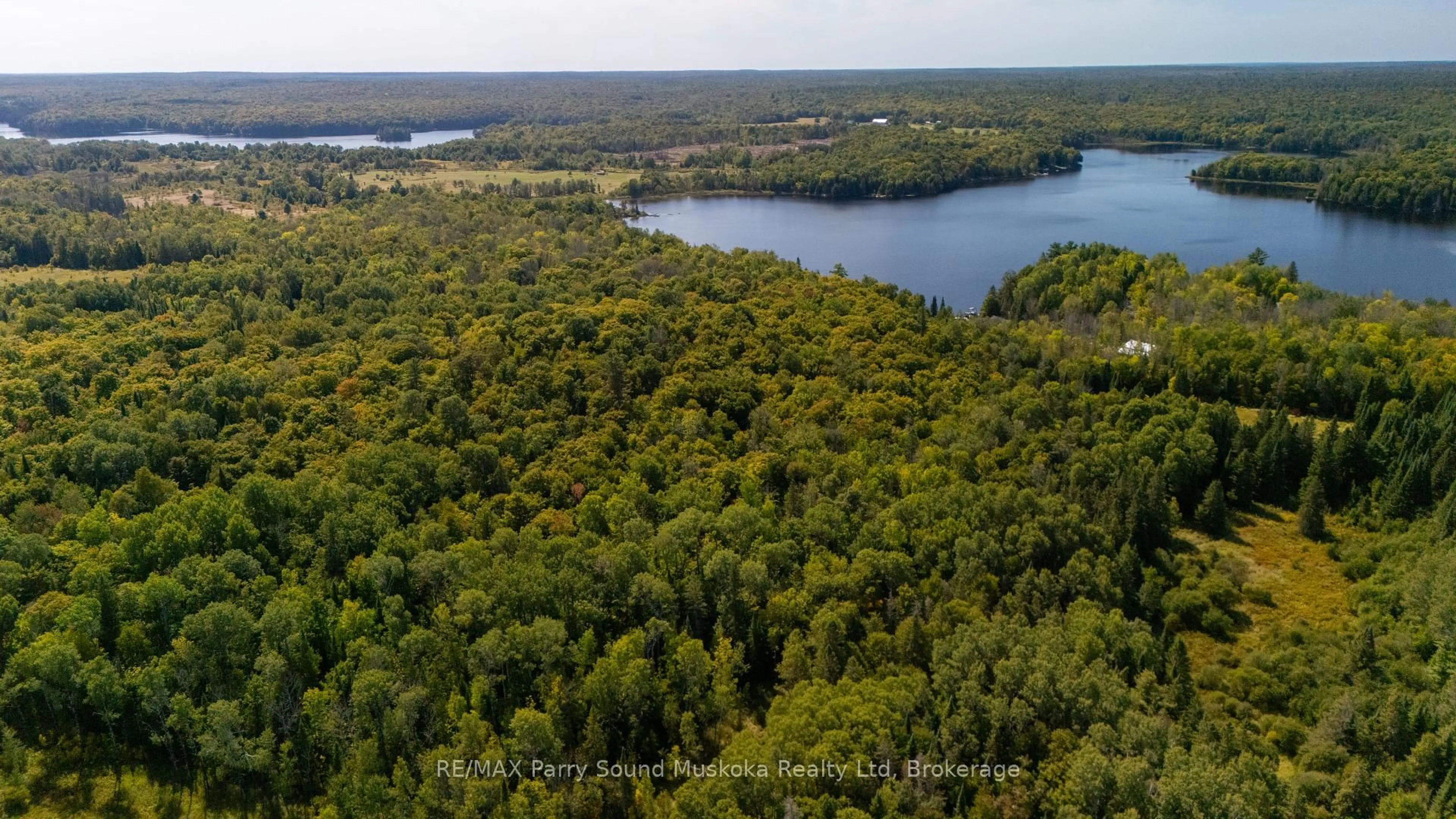 A pic from outside/outdoor area/front of a property/back of a property/a pic from drone, water/lake/river/ocean view for 40 Sunset Cove Rd, Seguin Ontario P2A 0B6