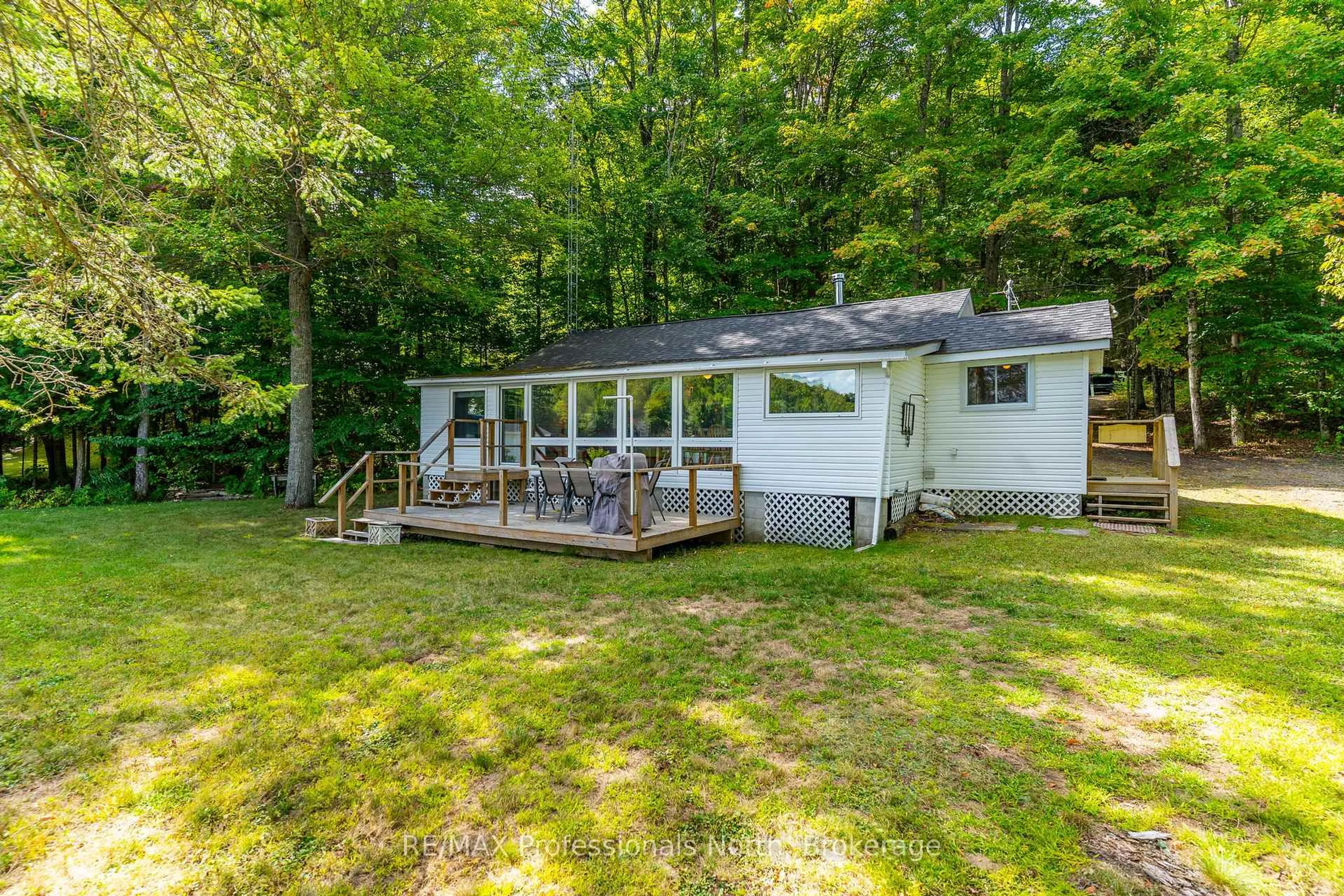 A pic from outside/outdoor area/front of a property/back of a property/a pic from drone, water/lake/river/ocean view for 1083 Elsie Bay Dr, Minden Hills Ontario K0M 2K0