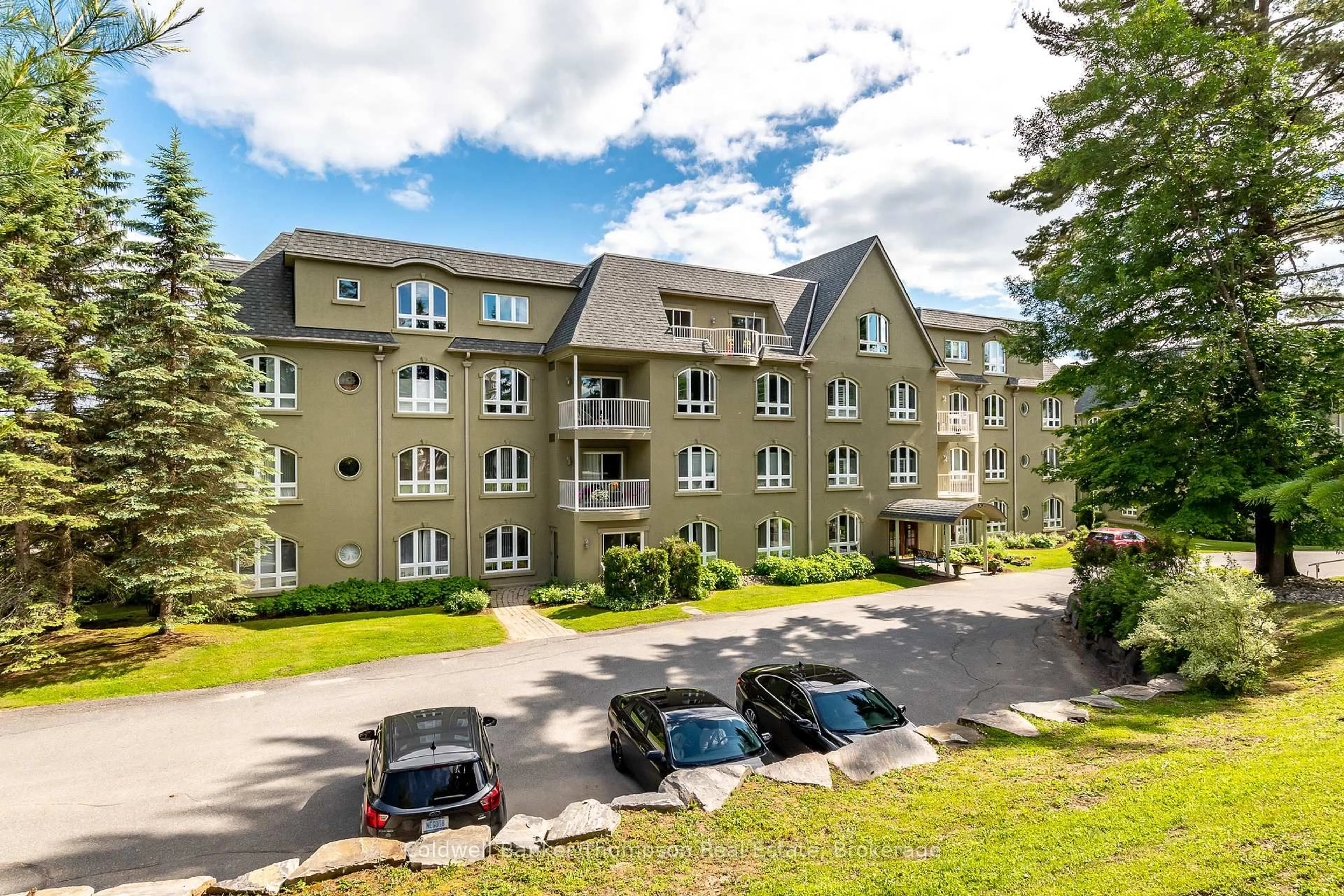 A pic from outside/outdoor area/front of a property/back of a property/a pic from drone, mountain view for 31 Dairy Lane #203, Huntsville Ontario P1H 2L7