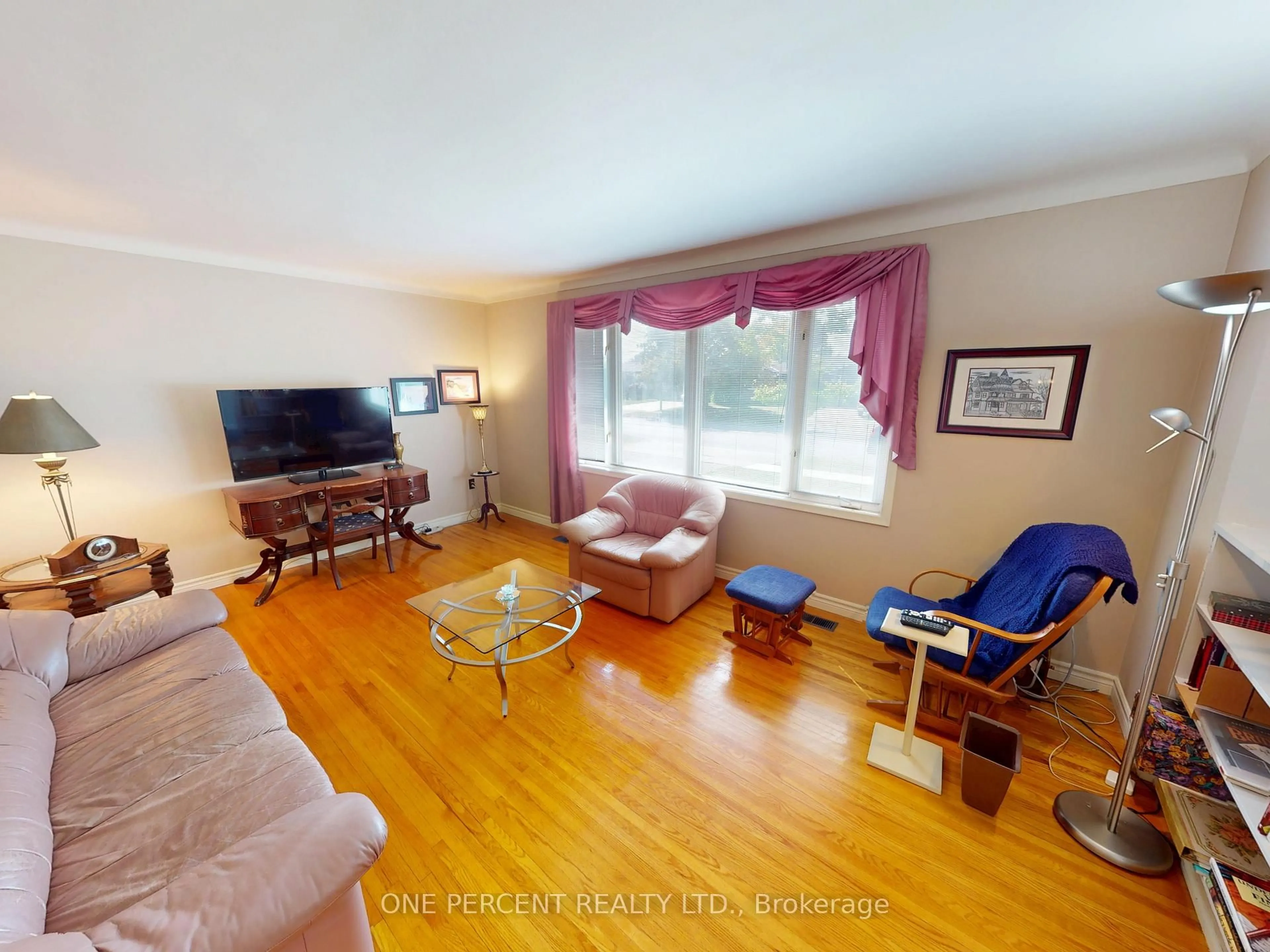 Living room with furniture, wood/laminate floor for 51 Memorial Park Dr, Welland Ontario L3B 1A5