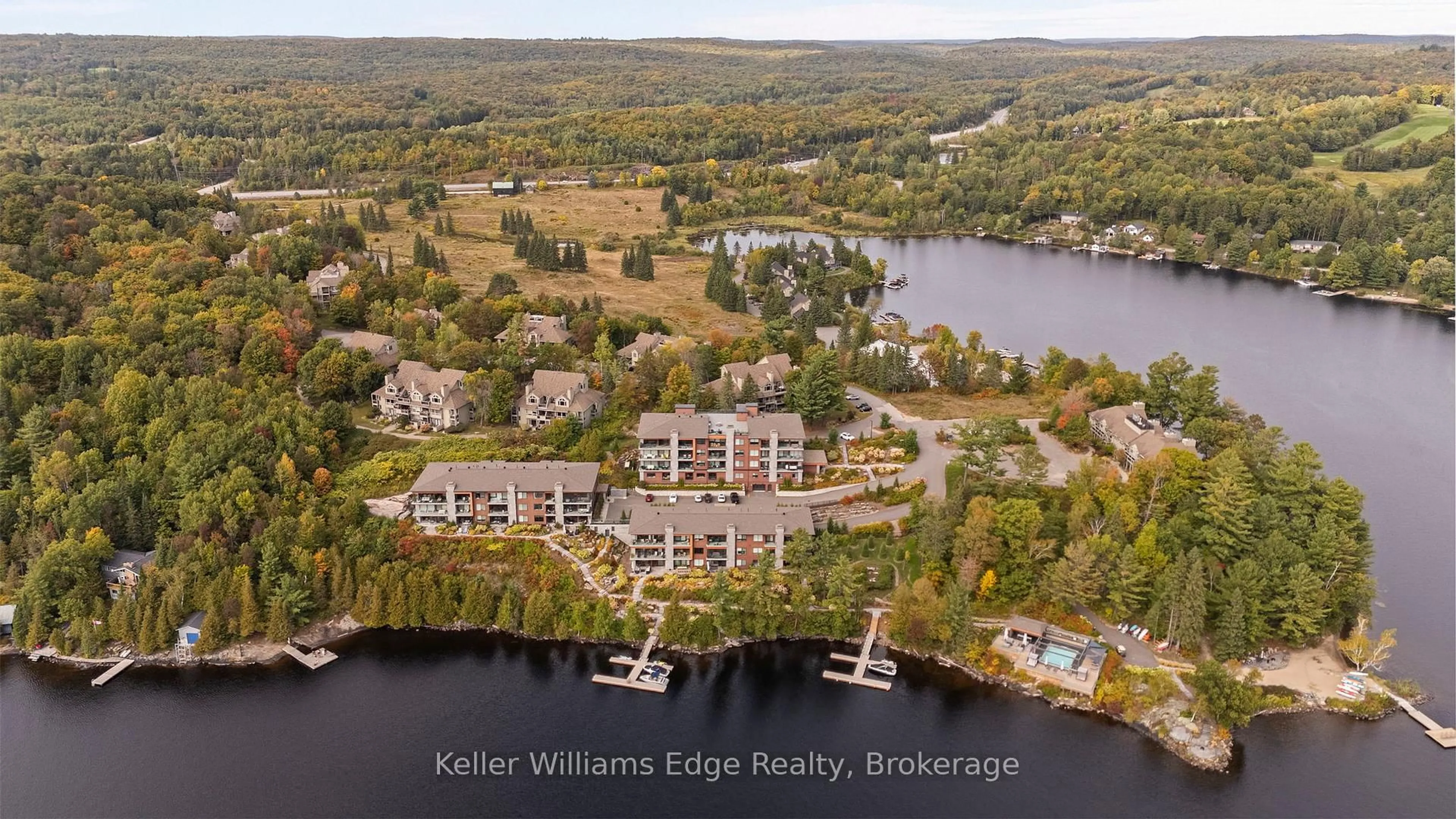A pic from outside/outdoor area/front of a property/back of a property/a pic from drone, water/lake/river/ocean view for 727 Grandview Dr #209, Huntsville Ontario P1H 2J5