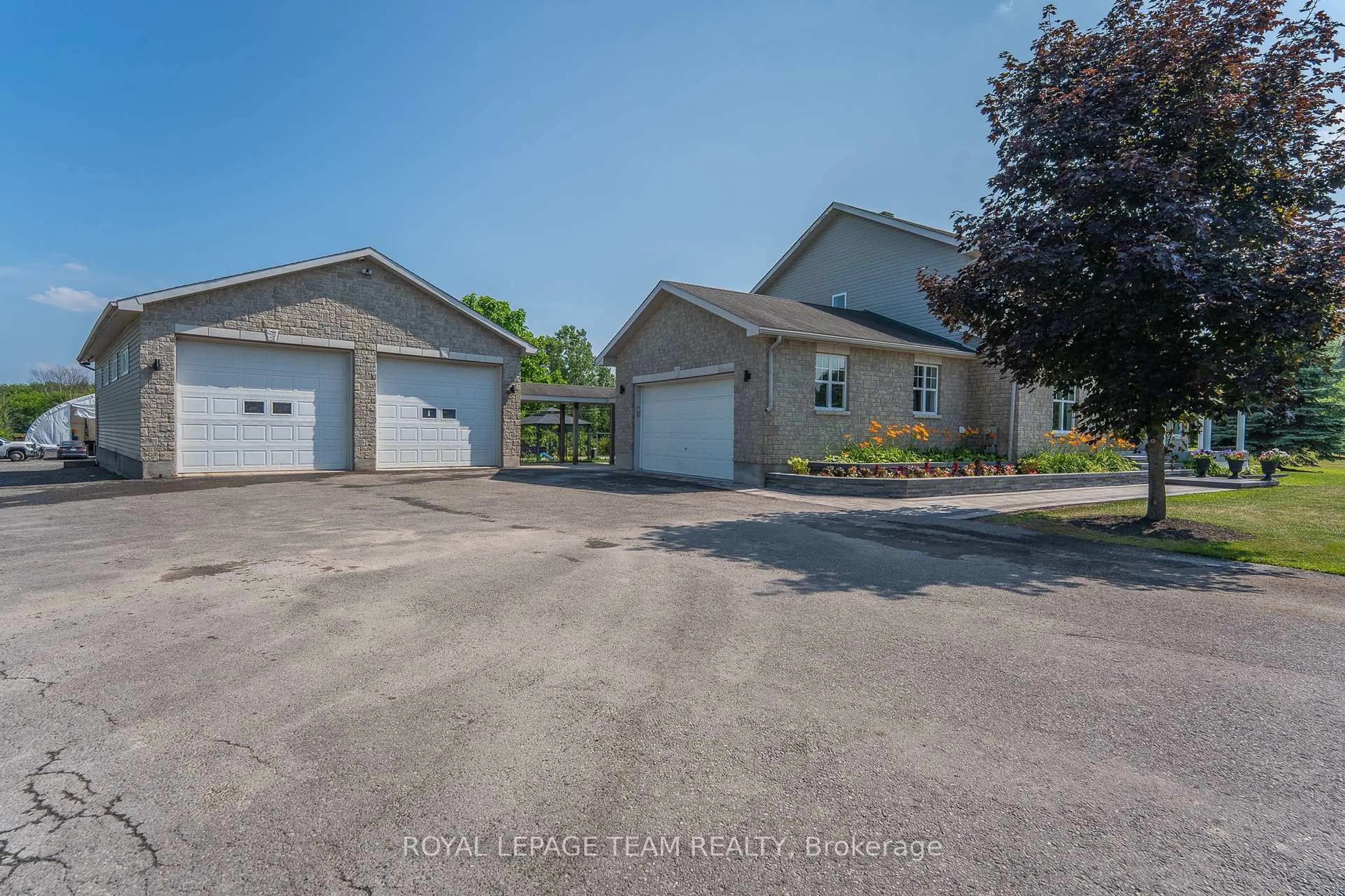 A pic from outside/outdoor area/front of a property/back of a property/a pic from drone, street for 7474 Mitch Owens Rd, Ottawa Ontario K4P 1K9