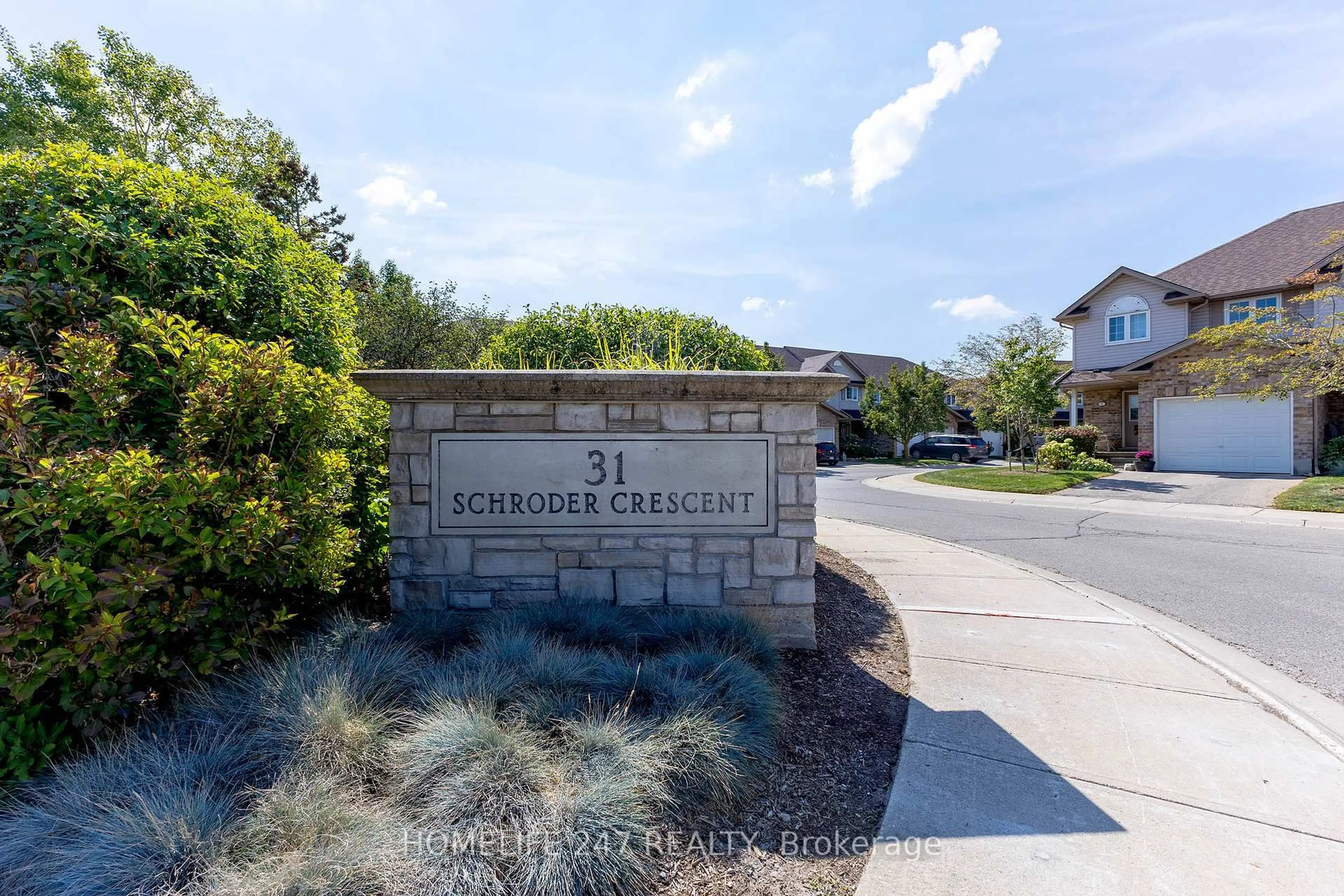 A pic from outside/outdoor area/front of a property/back of a property/a pic from drone, street for 31 Schroder Cres #5, Guelph Ontario N1E 7M6
