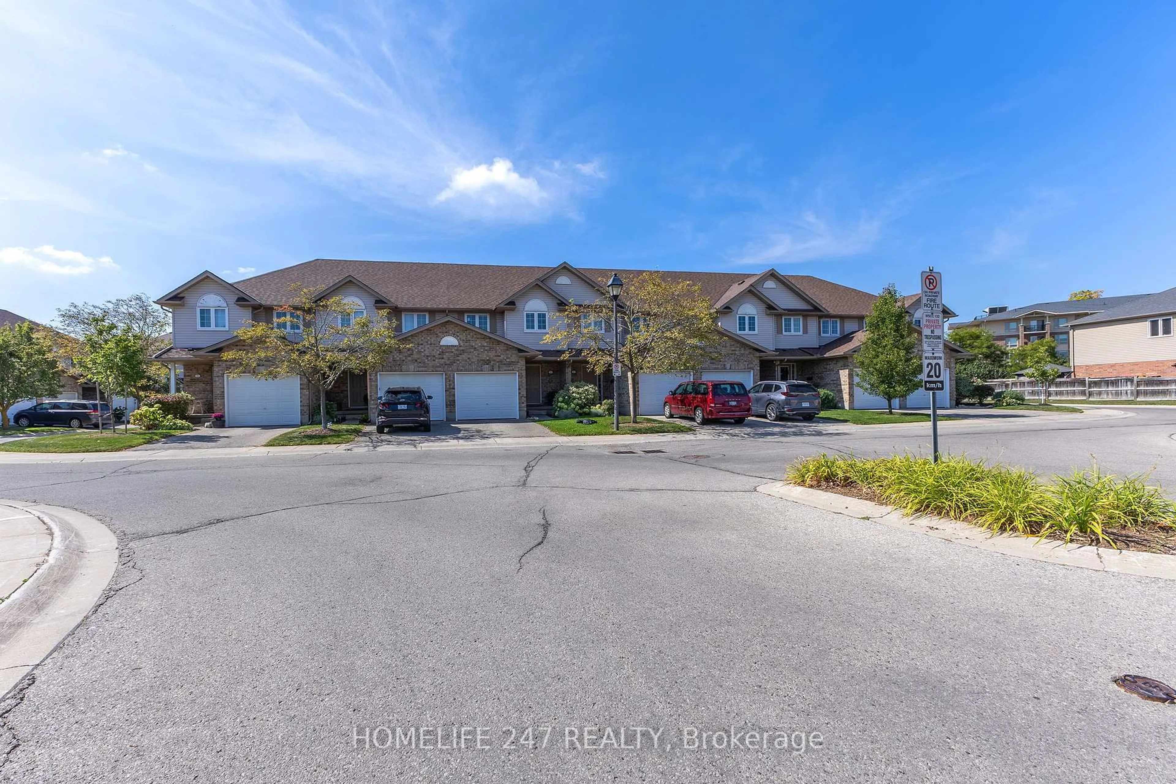 A pic from outside/outdoor area/front of a property/back of a property/a pic from drone, street for 31 Schroder Cres #5, Guelph Ontario N1E 7M6