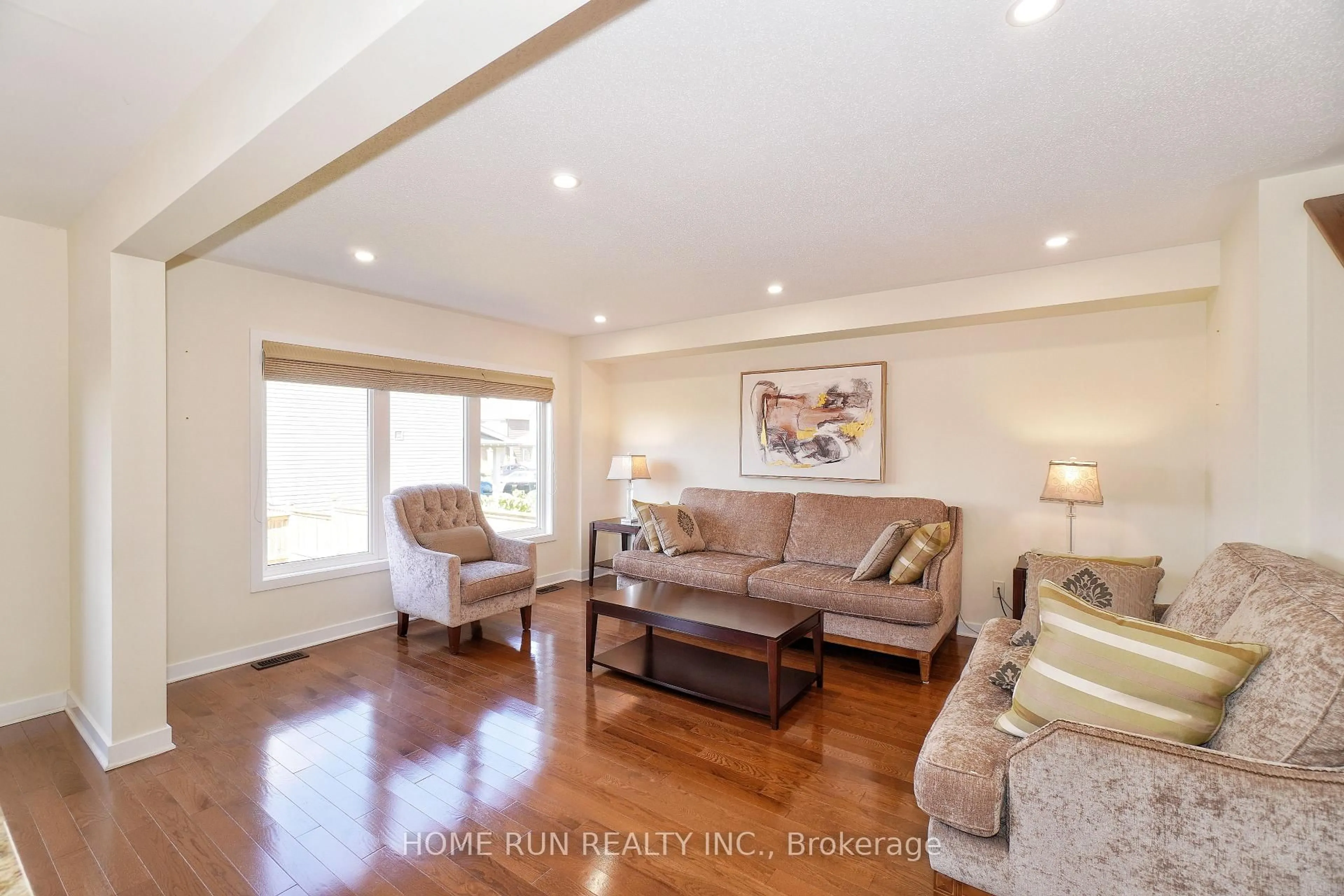Living room with furniture, wood/laminate floor for 503 Paine Ave, Ottawa Ontario K2T 0K7
