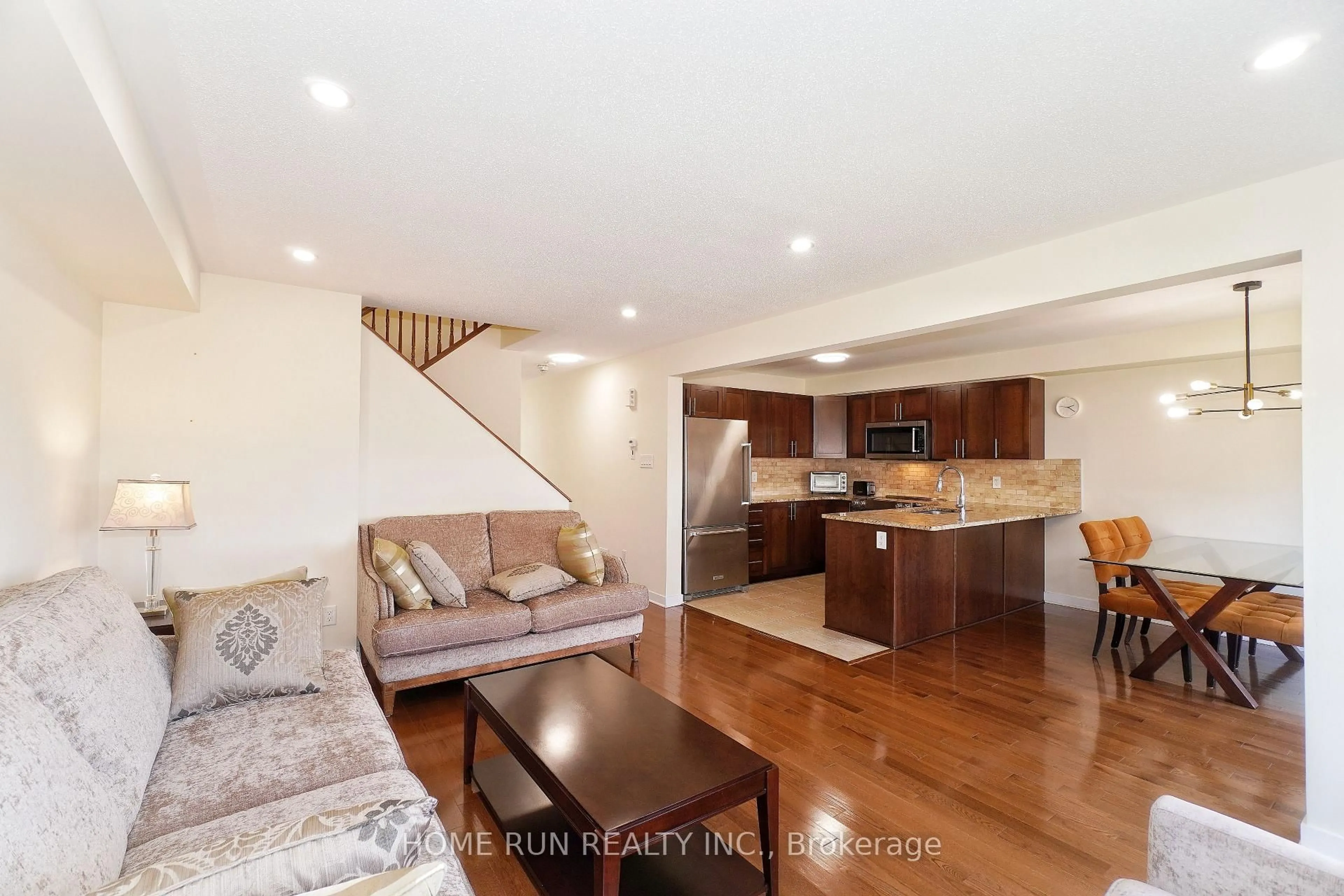 Living room with furniture, wood/laminate floor for 503 Paine Ave, Ottawa Ontario K2T 0K7