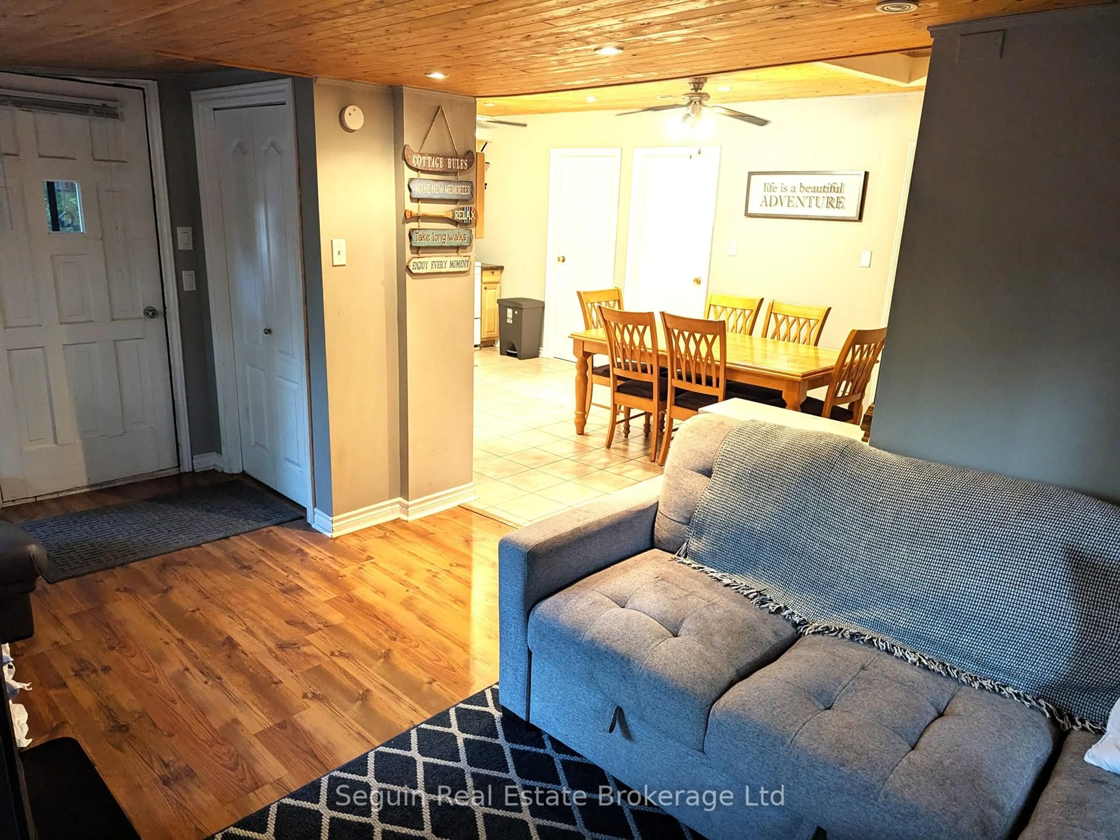 Living room with furniture, wood/laminate floor for 90 Bradley Rd, Seguin Ontario P2A 0B6