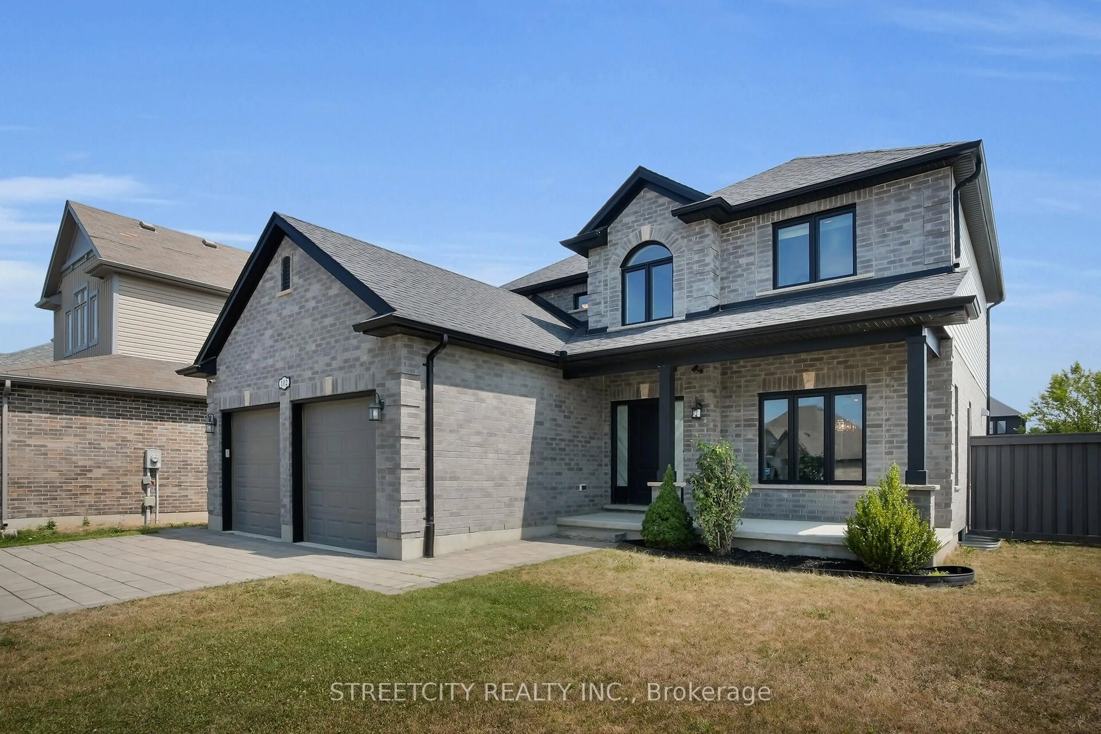 Home with brick exterior material, street for 102 Timberwalk Tr, Middlesex Centre Ontario N0M 2A0