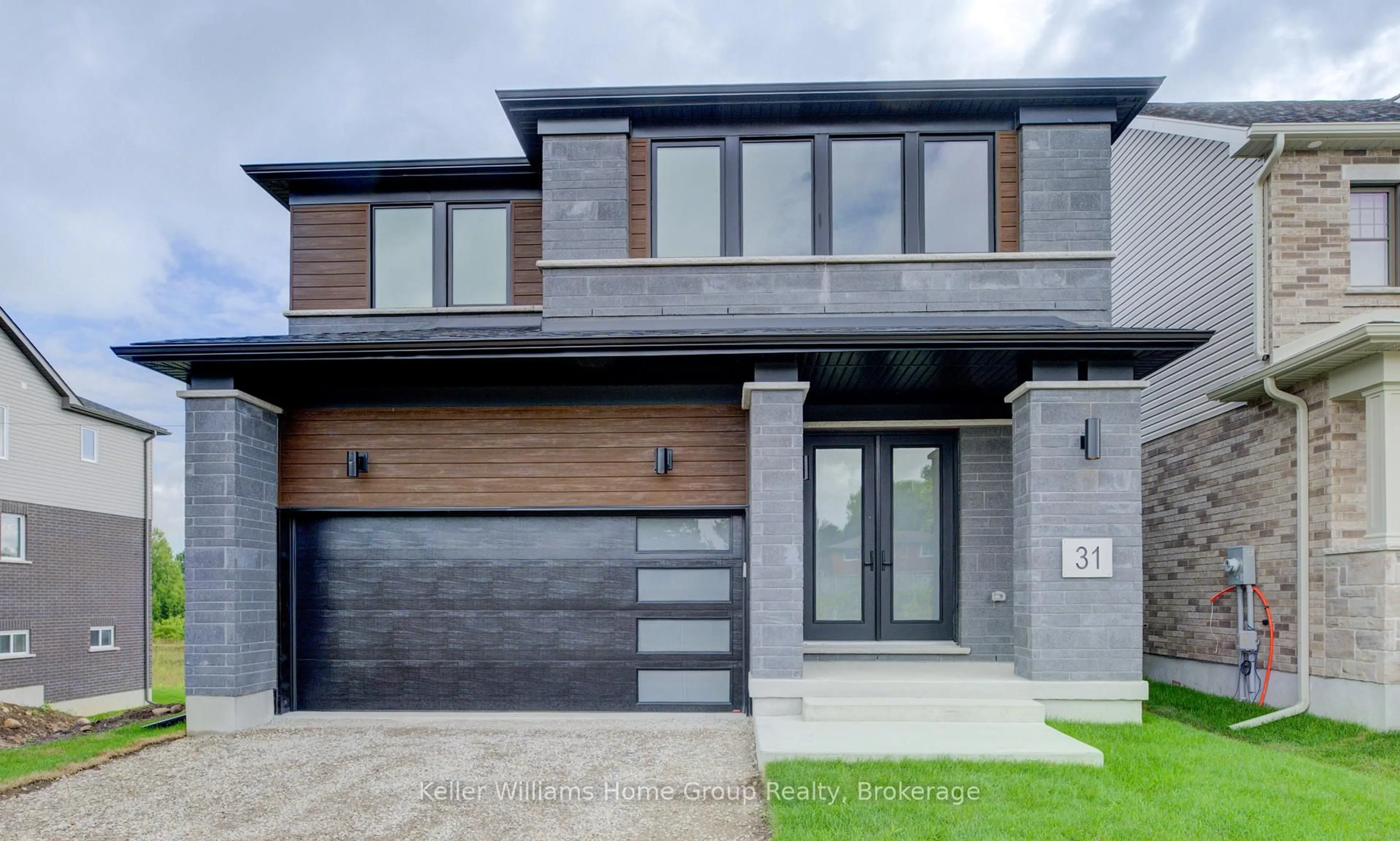Home with brick exterior material, street for 31 Nicholas Way, Guelph Ontario N1E 0T1