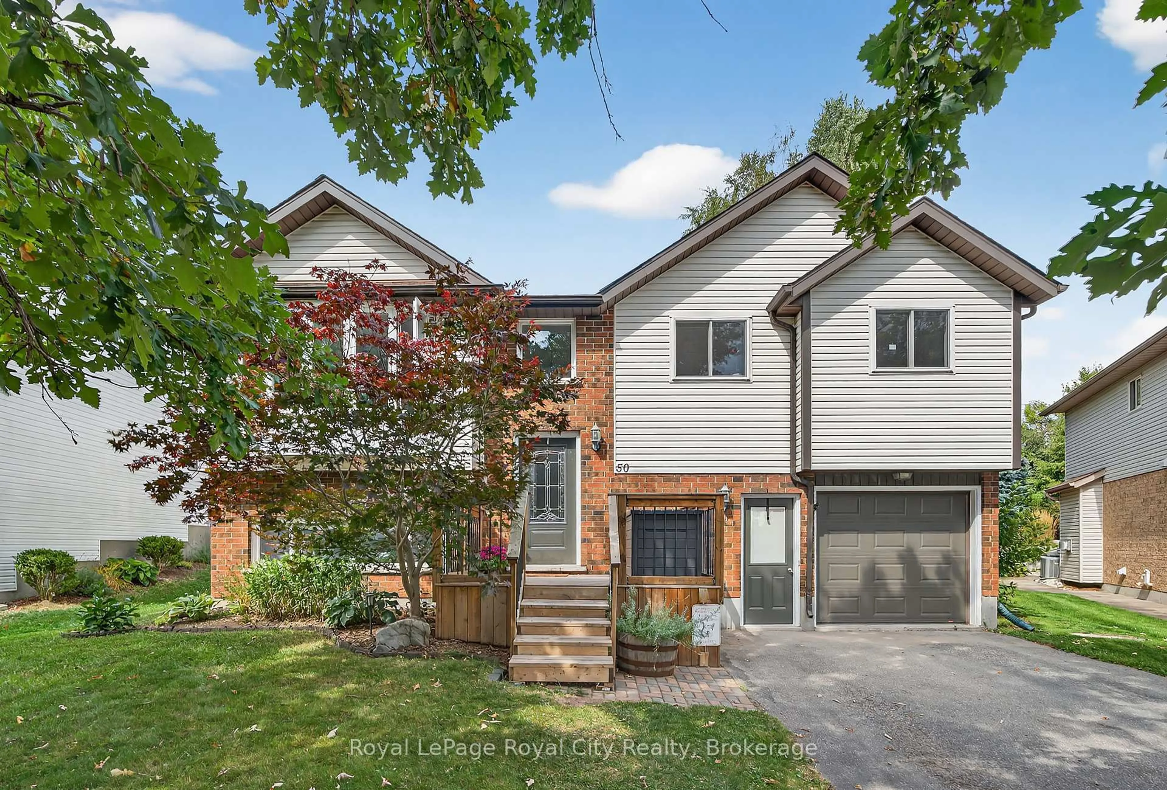 Home with brick exterior material, street for 50 Mclachlan Pl, Guelph Ontario N1H 8K4