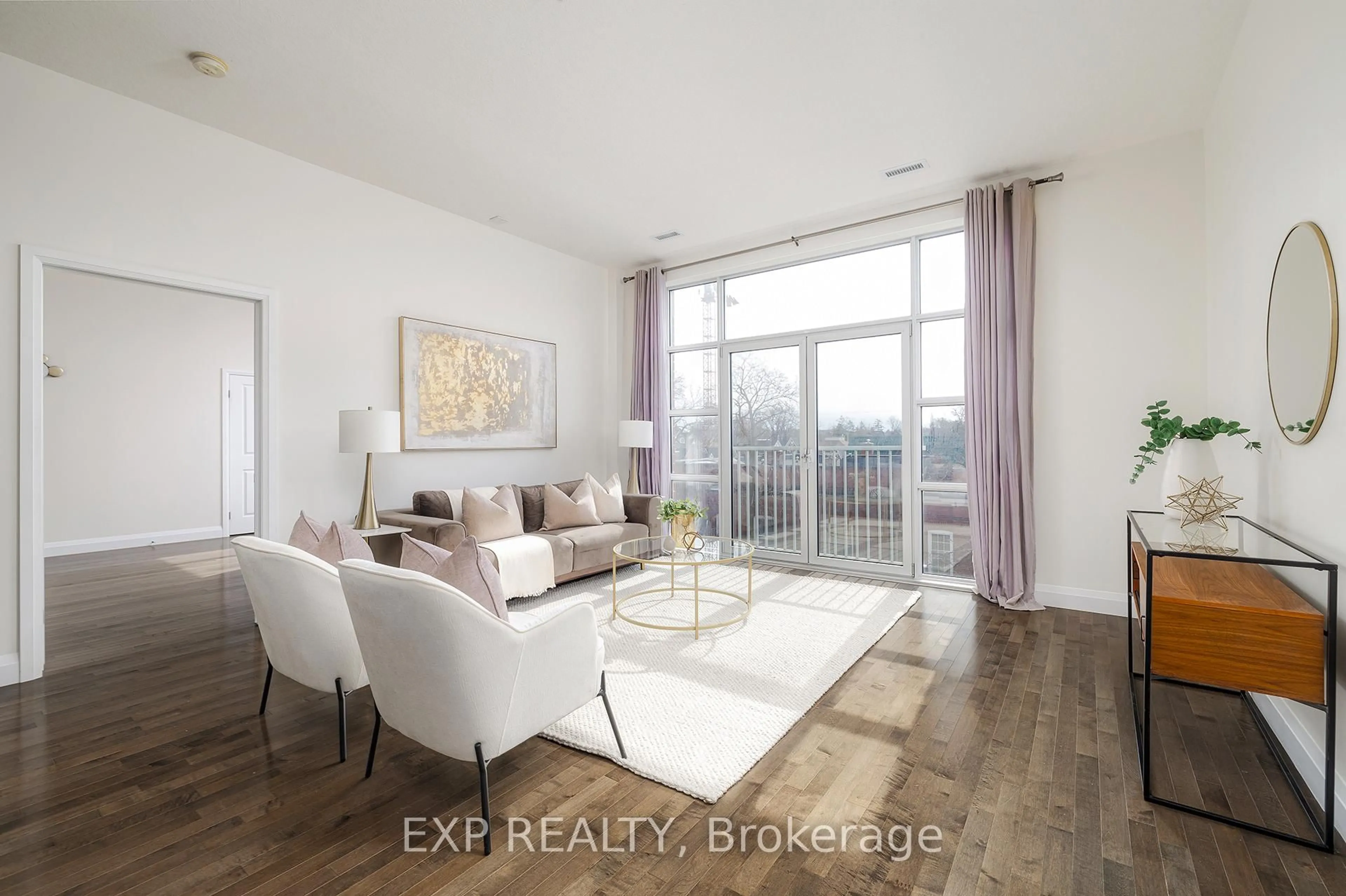 Living room with furniture, wood/laminate floor for 165 Duke St, Kitchener Ontario N2H 6T8