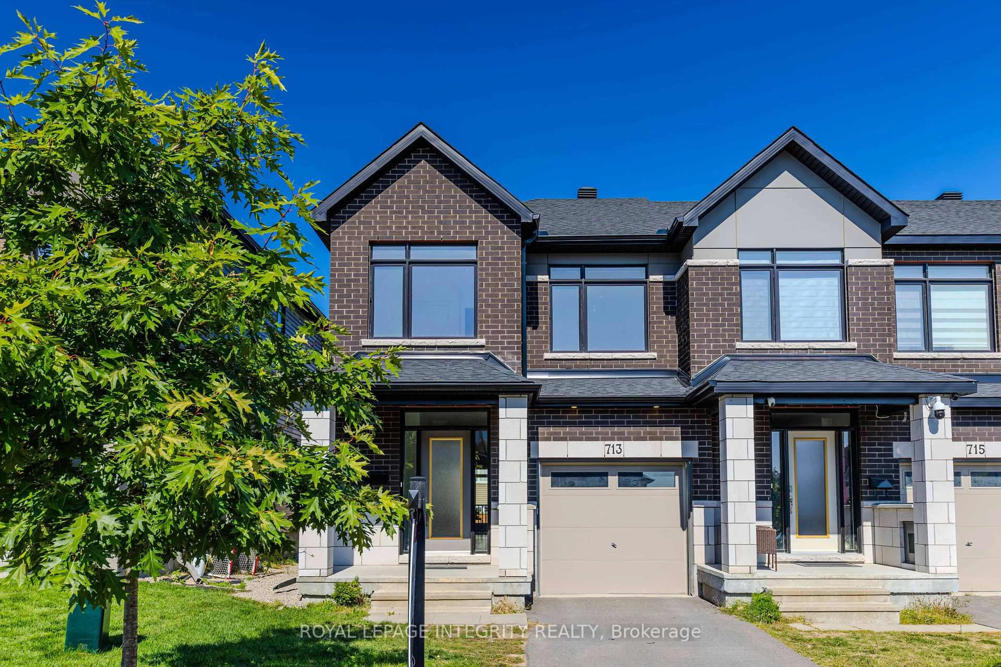 Home with brick exterior material, street for 713 Teasel Way, Ottawa Ontario K1T 0M1