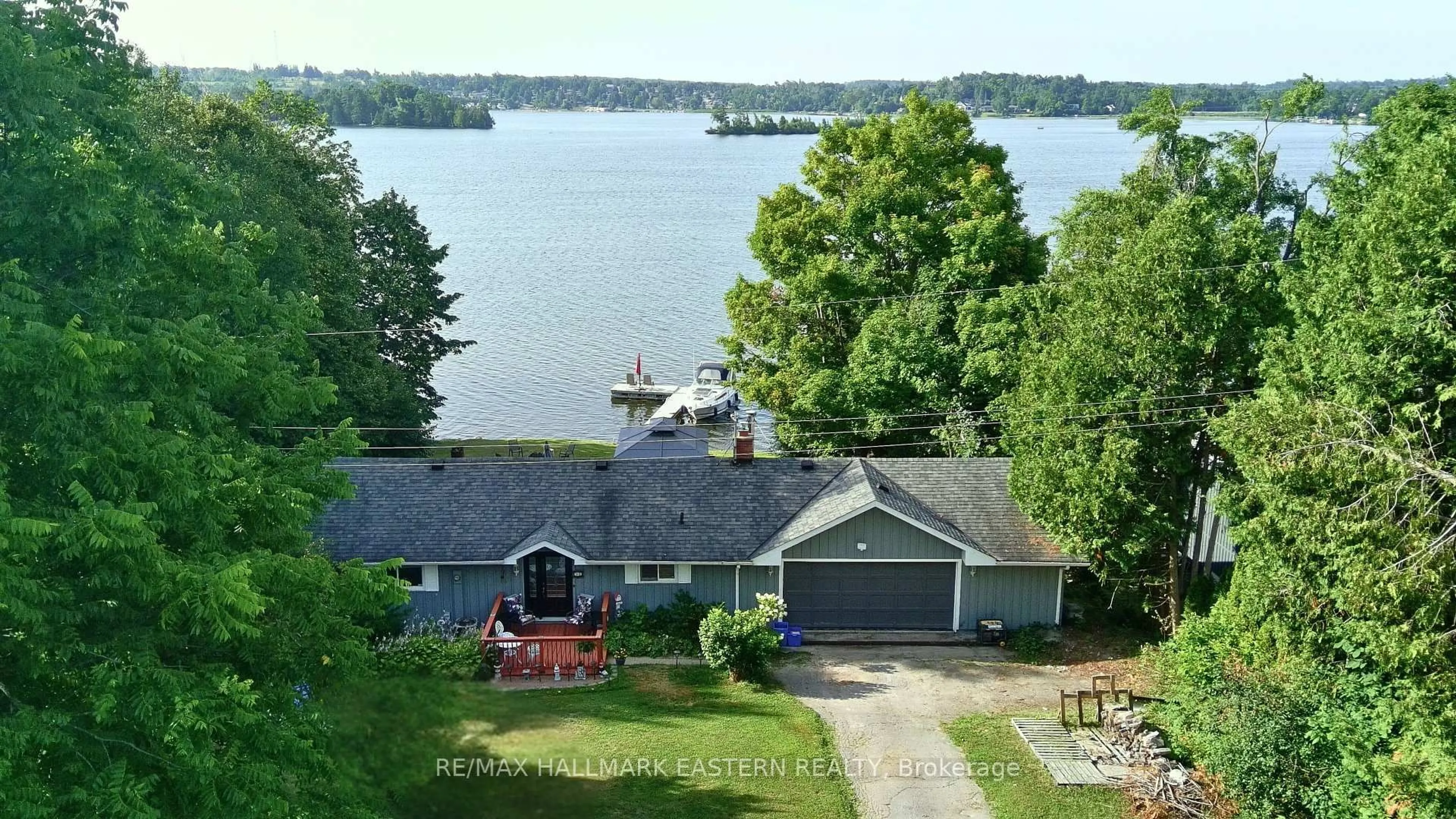 A pic from outside/outdoor area/front of a property/back of a property/a pic from drone, water/lake/river/ocean view for 51 Darling Dr, Selwyn Ontario K0L 2W0