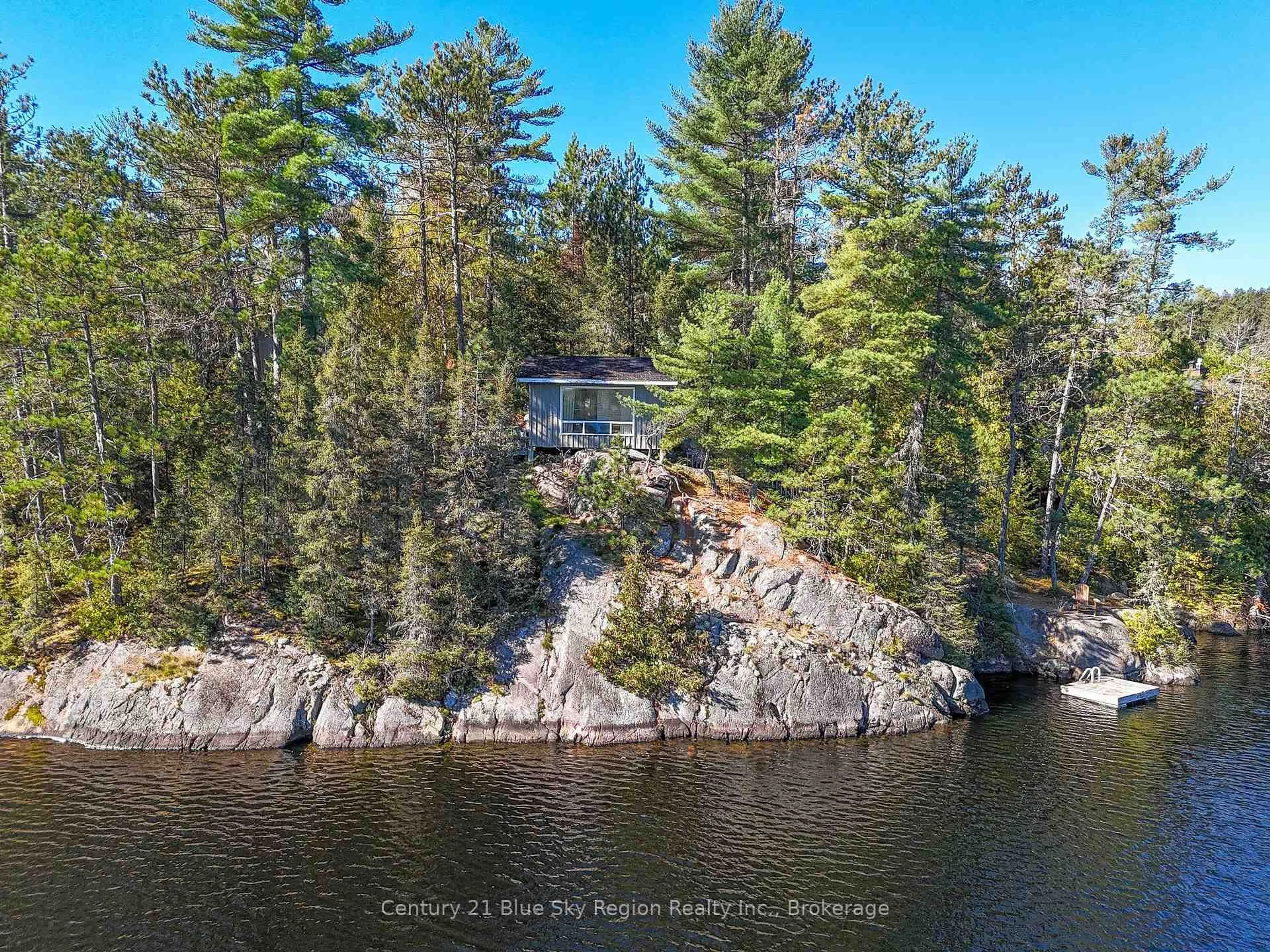 A pic from outside/outdoor area/front of a property/back of a property/a pic from drone, water/lake/river/ocean view for 5065 Highway 11, Temagami Ontario P0H 1H0