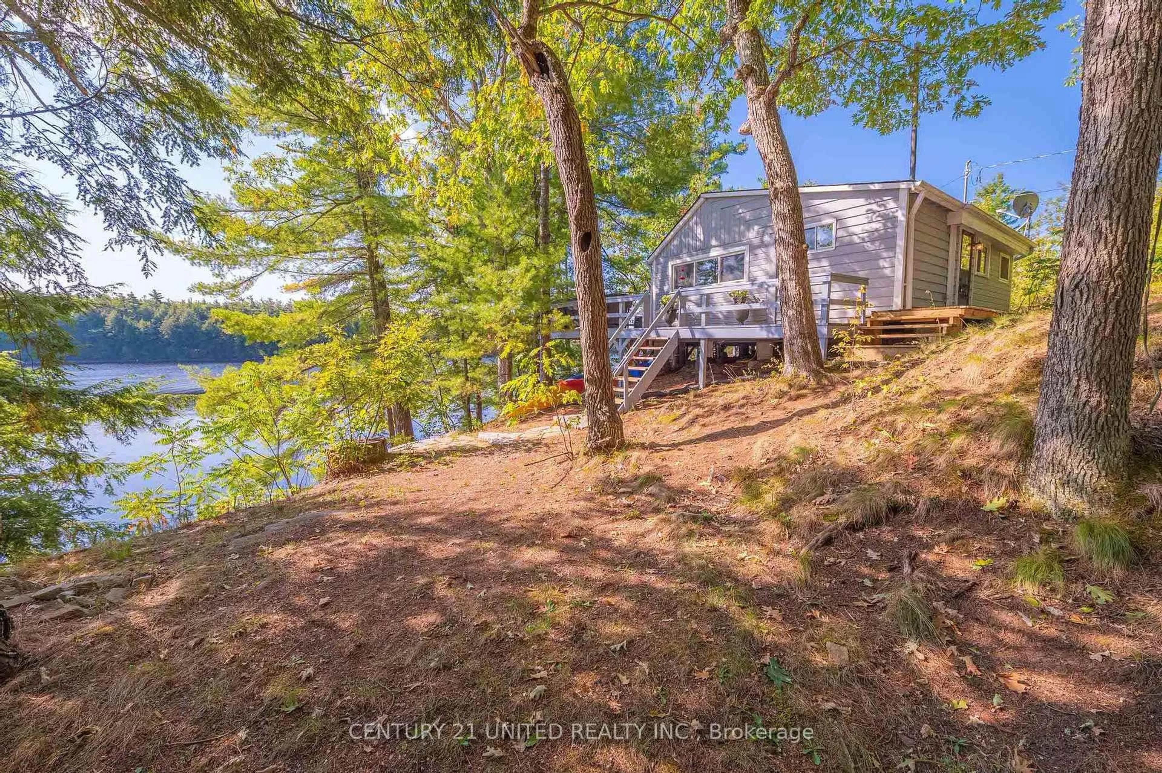 A pic from outside/outdoor area/front of a property/back of a property/a pic from drone, water/lake/river/ocean view for 20 Fire Route 147, Trent Lakes Ontario K0L 1J0