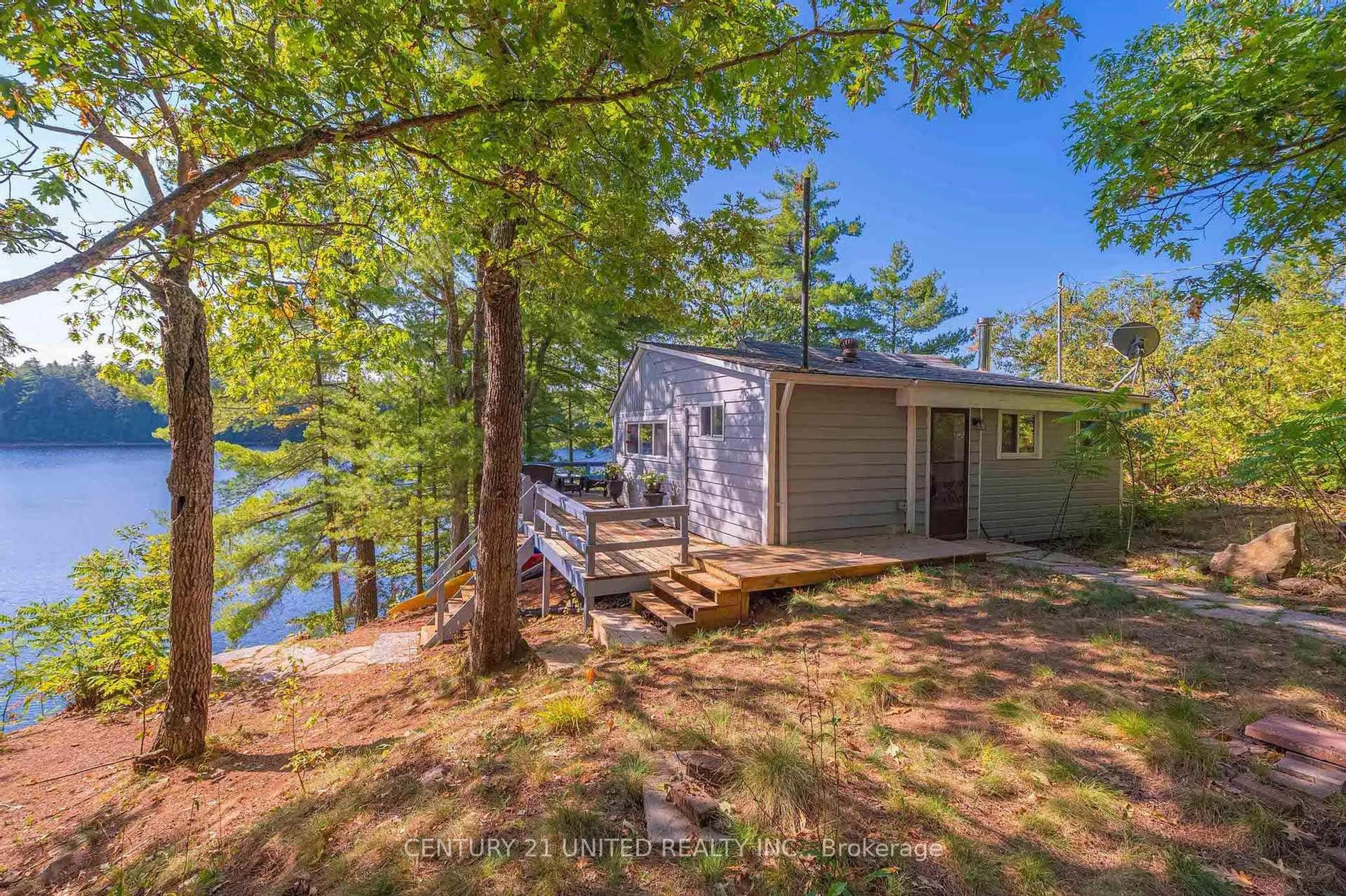 A pic from outside/outdoor area/front of a property/back of a property/a pic from drone, water/lake/river/ocean view for 20 Fire Route 147, Trent Lakes Ontario K0L 1J0