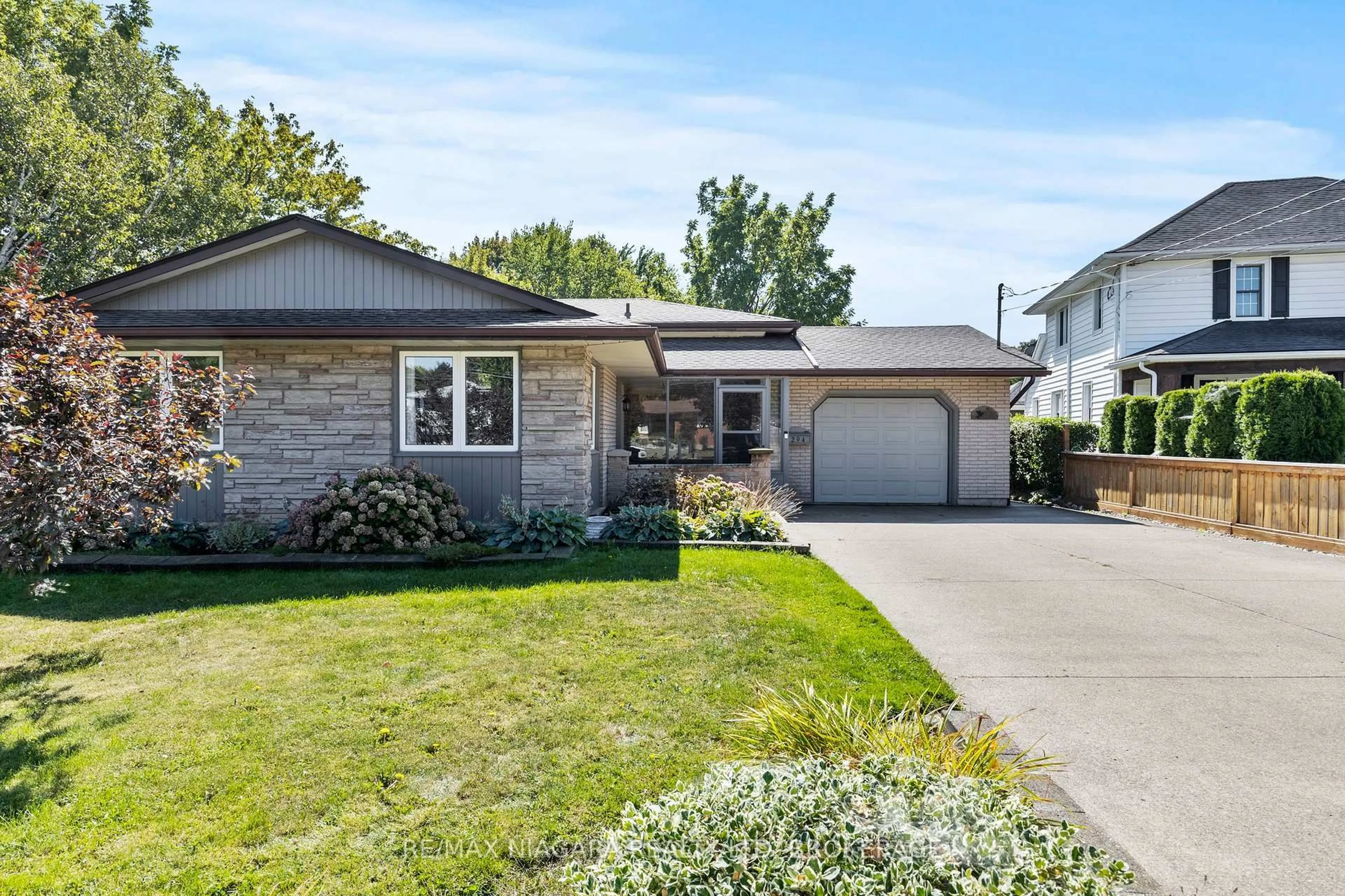 Home with vinyl exterior material, street for 294 Lakeshore Rd, St. Catharines Ontario L2M 6C3