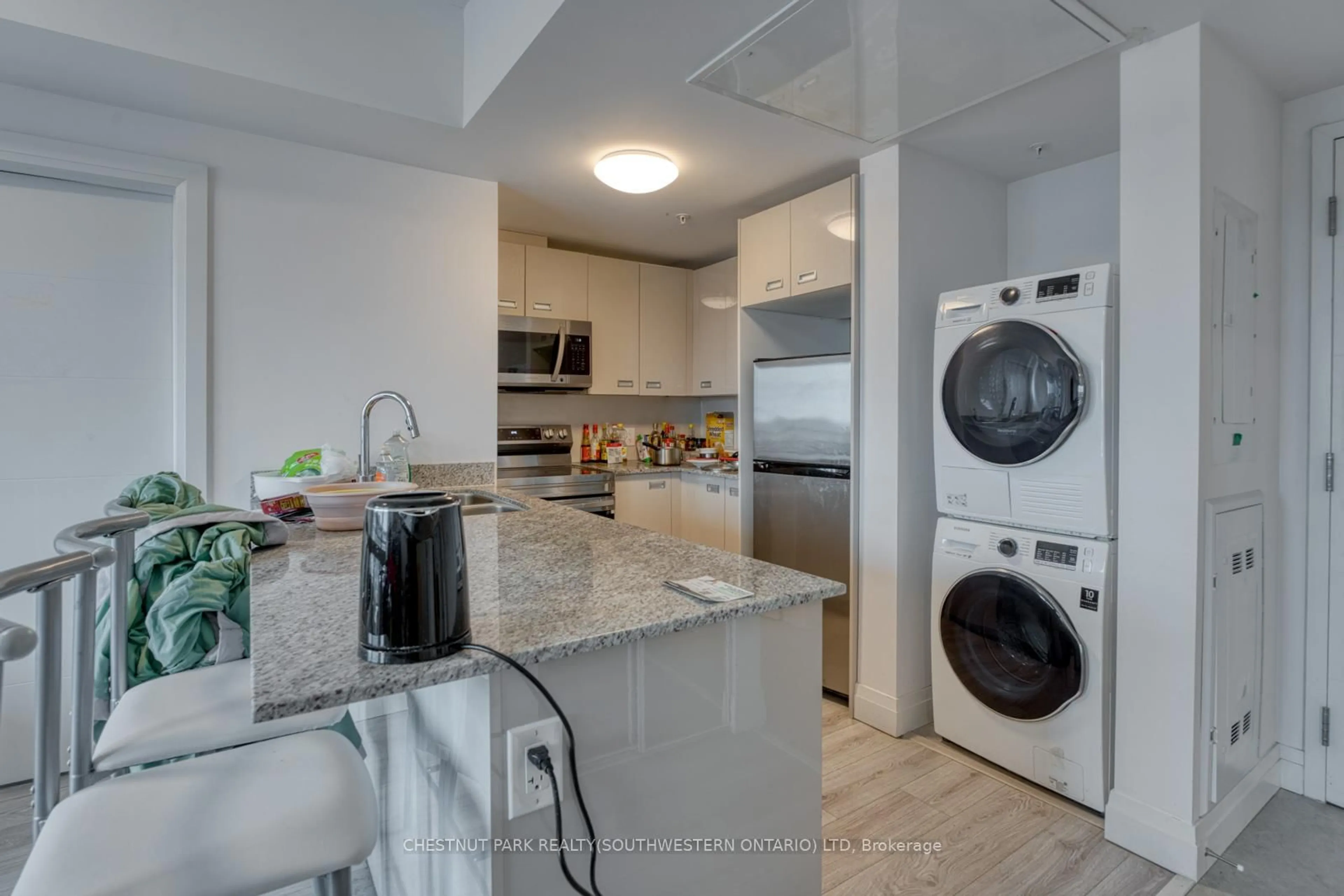 Kitchen with laundary machines, ceramic/tile floor for 652 Princess St #732, Kingston Ontario K7L 1E5