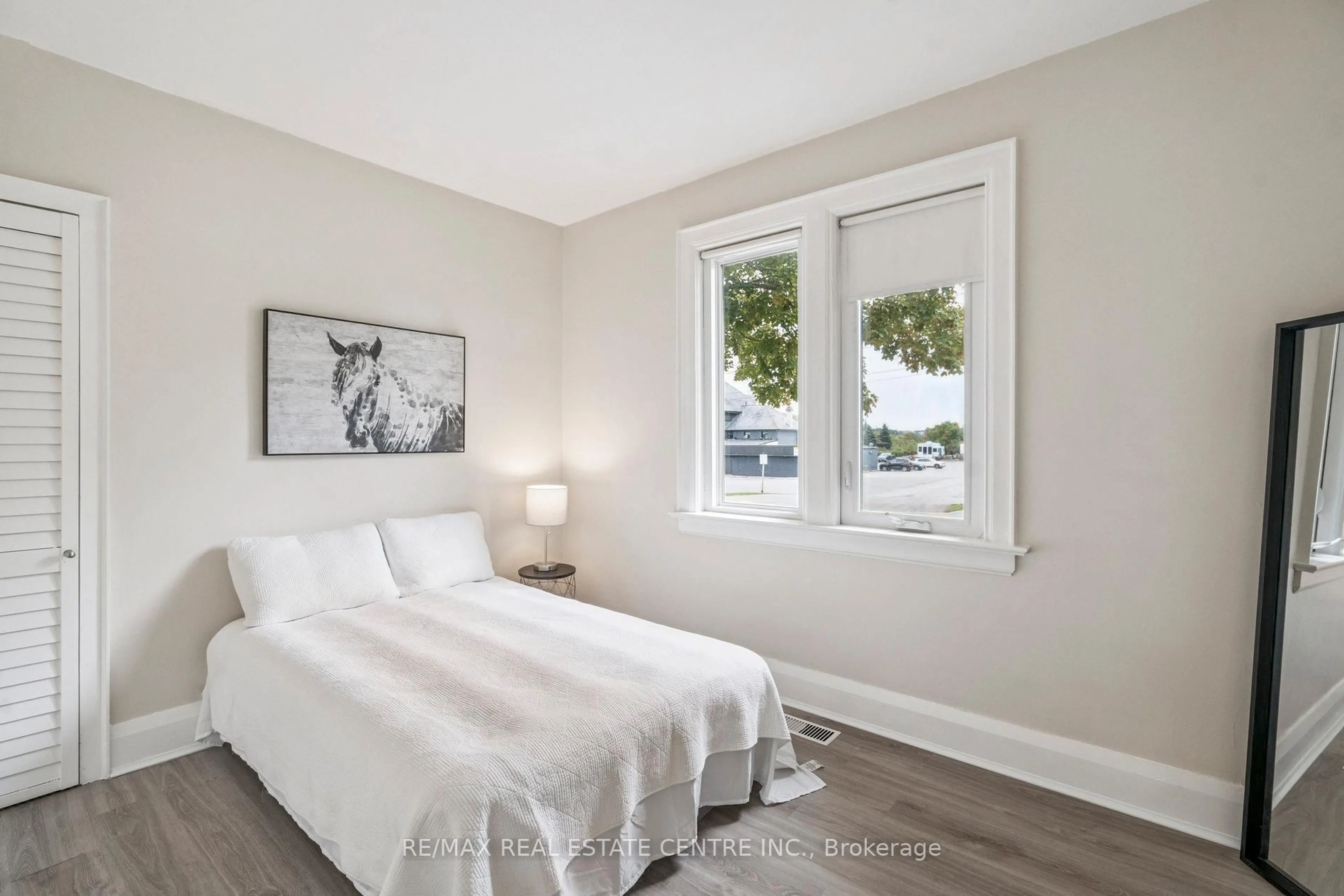 Bedroom with bed, wood/laminate floor for 196 Silvercreek Pkwy, Guelph Ontario N1H 3S7