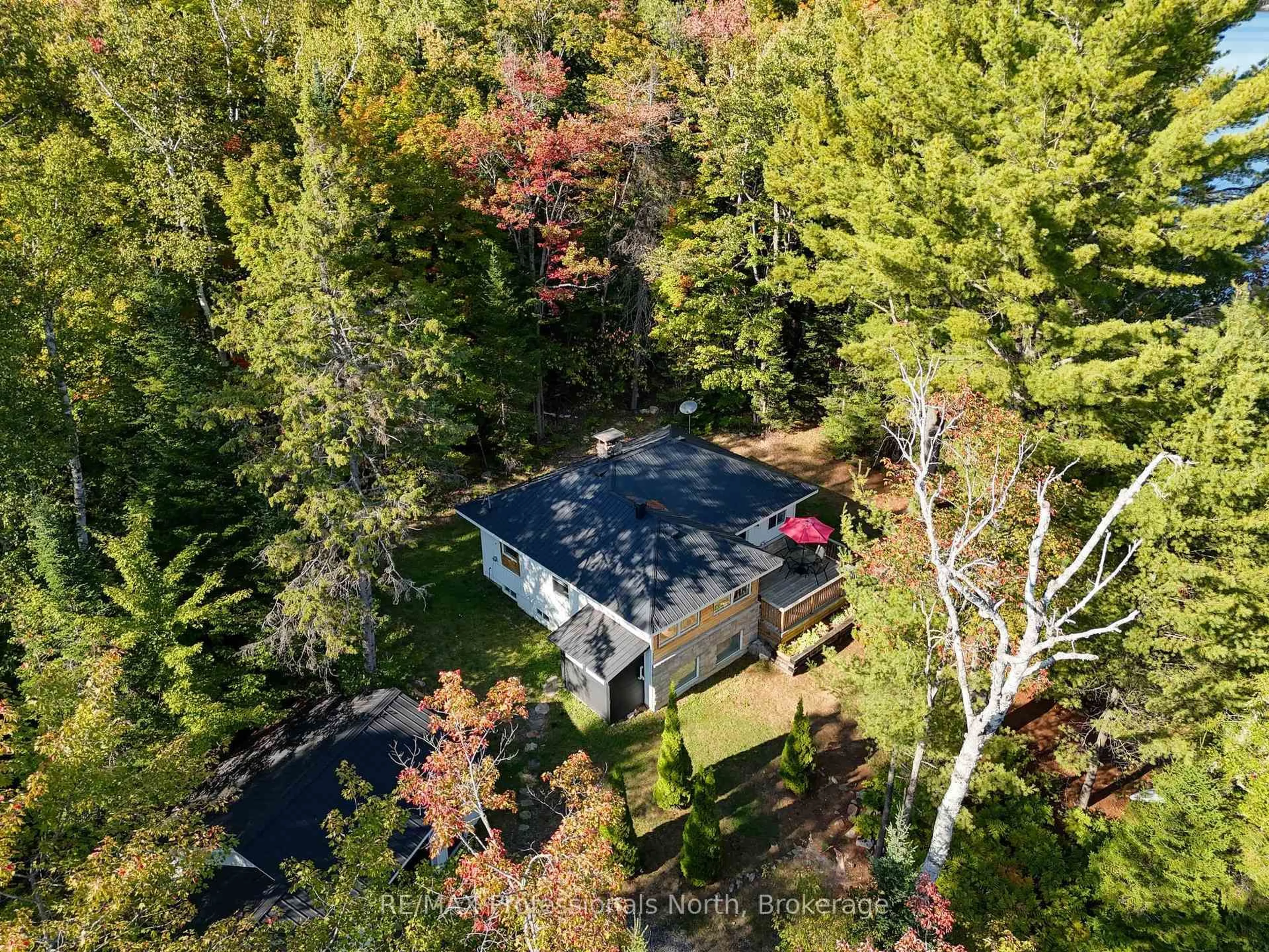 A pic from outside/outdoor area/front of a property/back of a property/a pic from drone, forest/trees view for 1046 Pine Lake Shores Private Rd, Bracebridge Ontario P0B 1A0