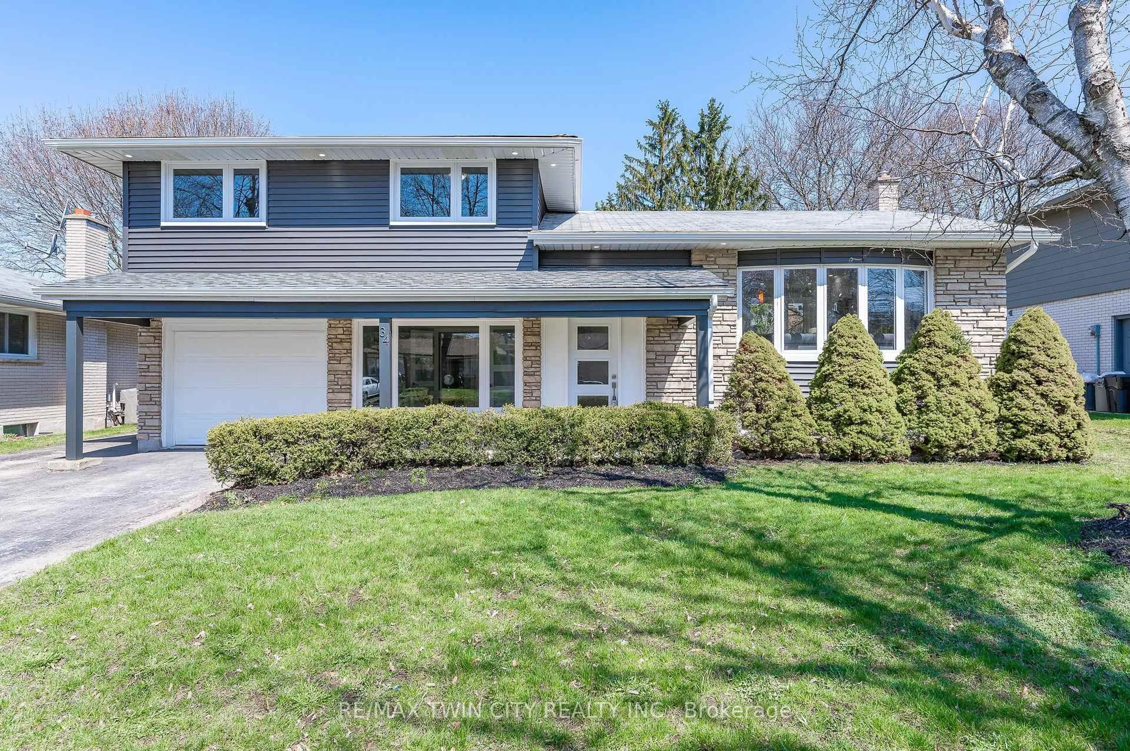 Home with vinyl exterior material, street for 34 BRADLEY Dr, Kitchener Ontario N2A 1K4