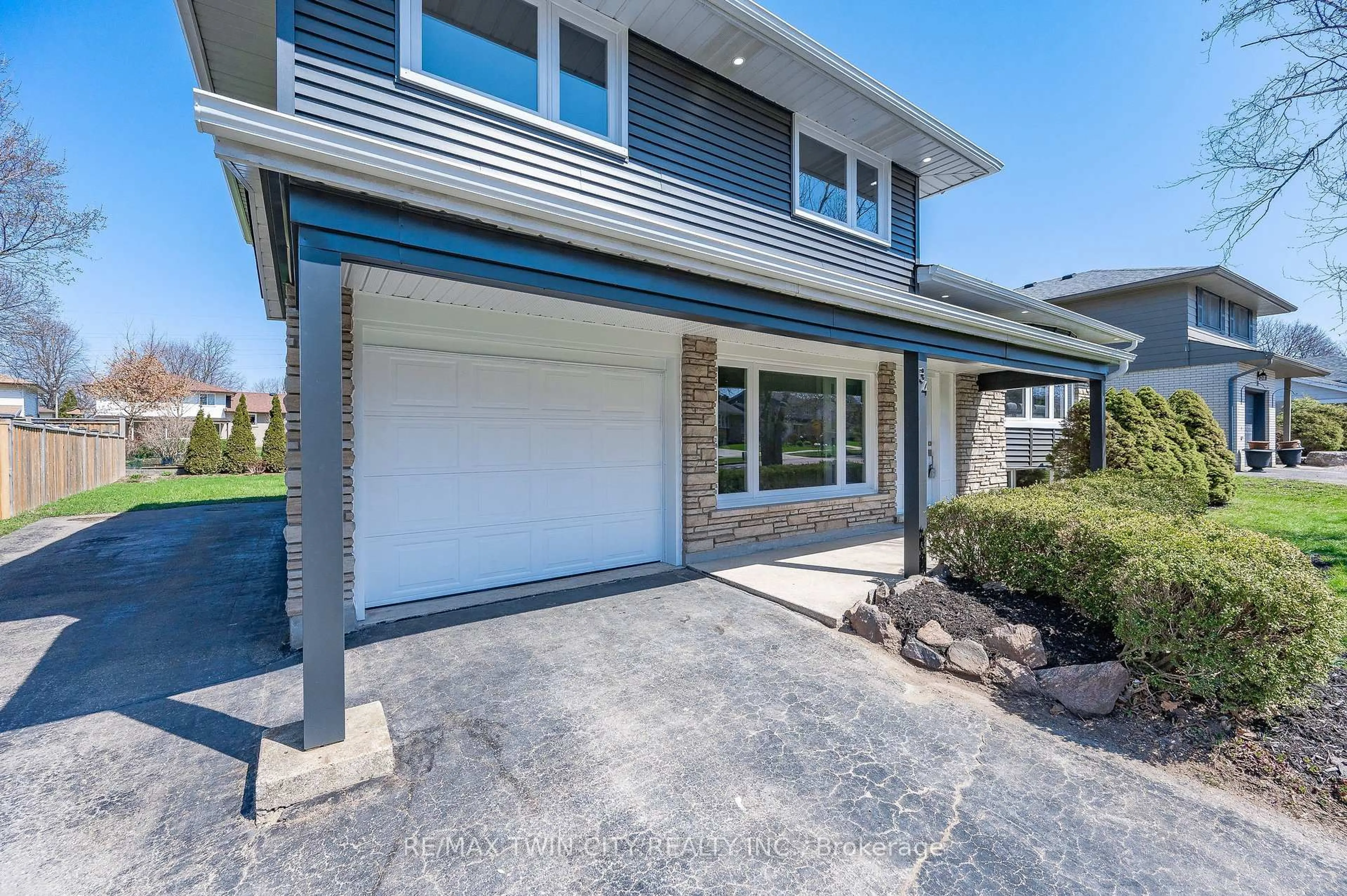 Home with vinyl exterior material, street for 34 BRADLEY Dr, Kitchener Ontario N2A 1K4