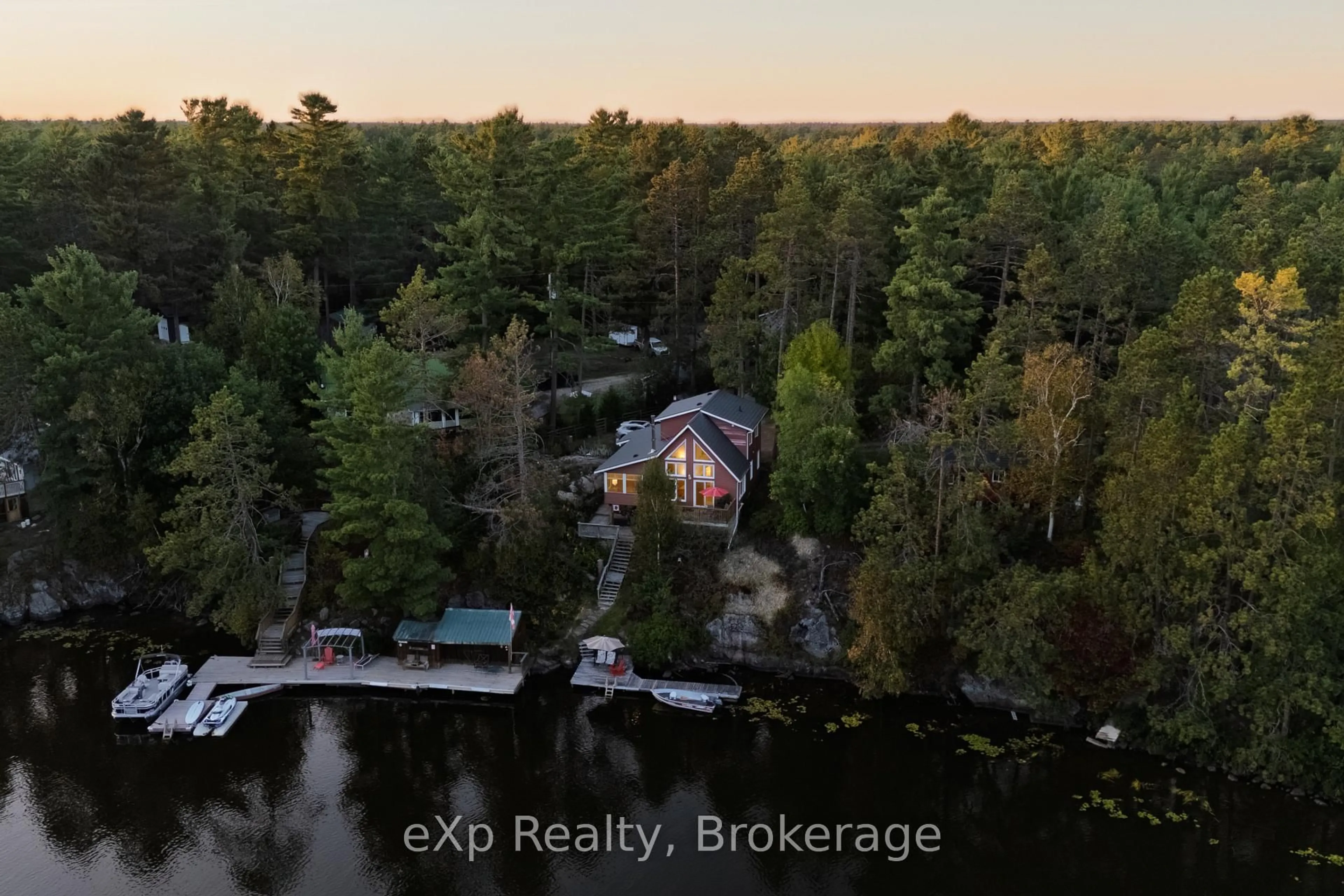A pic from outside/outdoor area/front of a property/back of a property/a pic from drone, water/lake/river/ocean view for 7953B 64 Highway, French River Ontario P0M 2K0