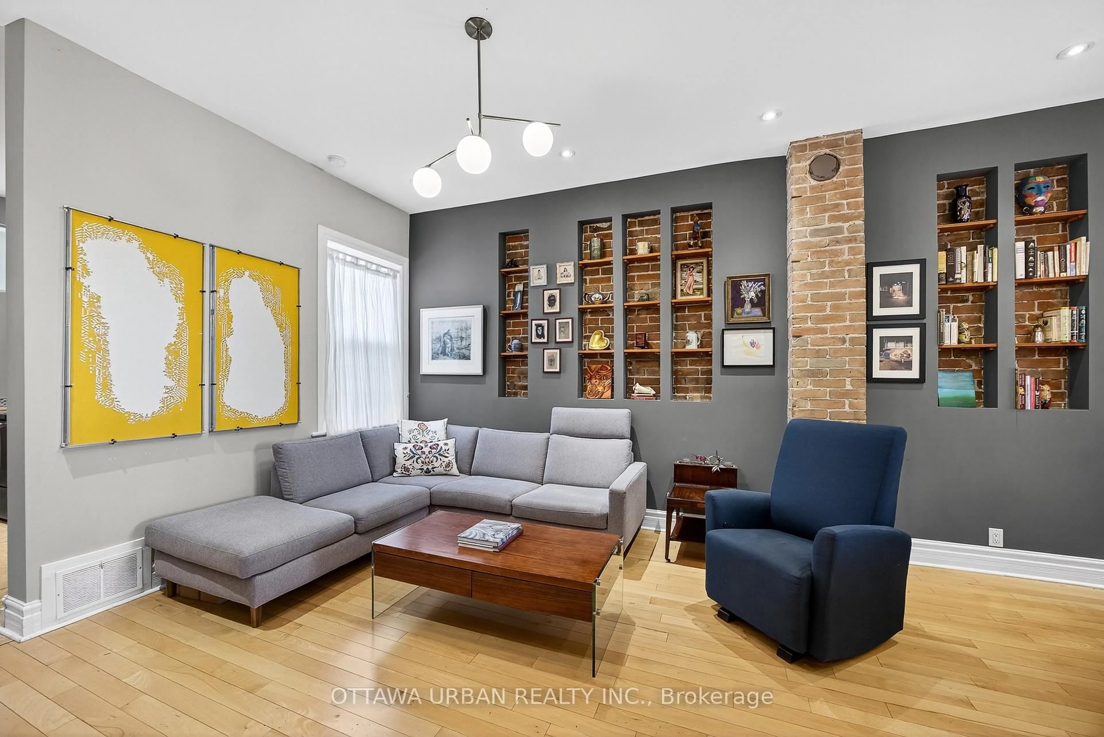 Living room with furniture, wood/laminate floor for 145 Rochester St, Ottawa Ontario K1R 7M2