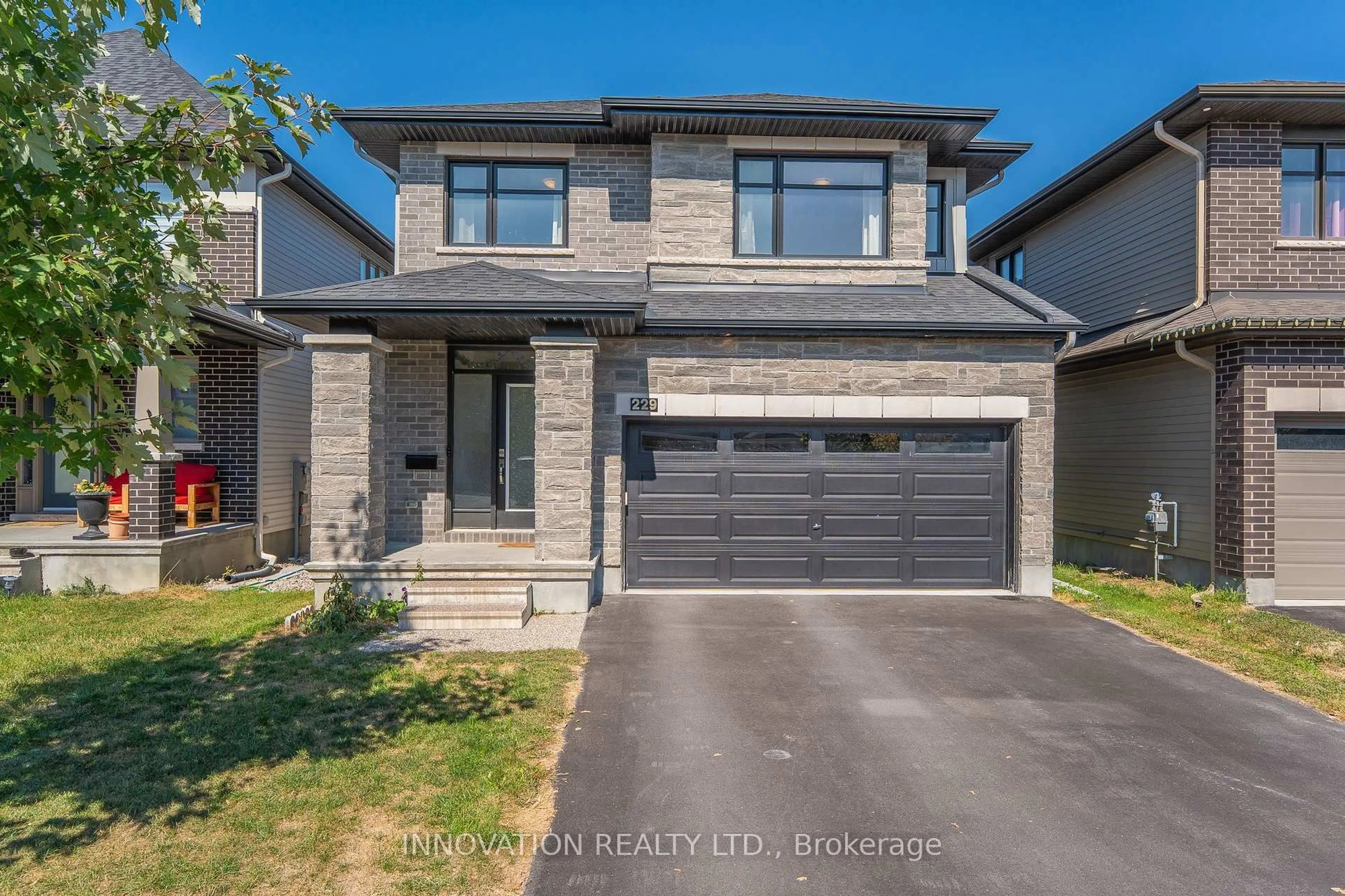 Home with brick exterior material, street for 229 Osterley Way, Ottawa Ontario K2S 2P2