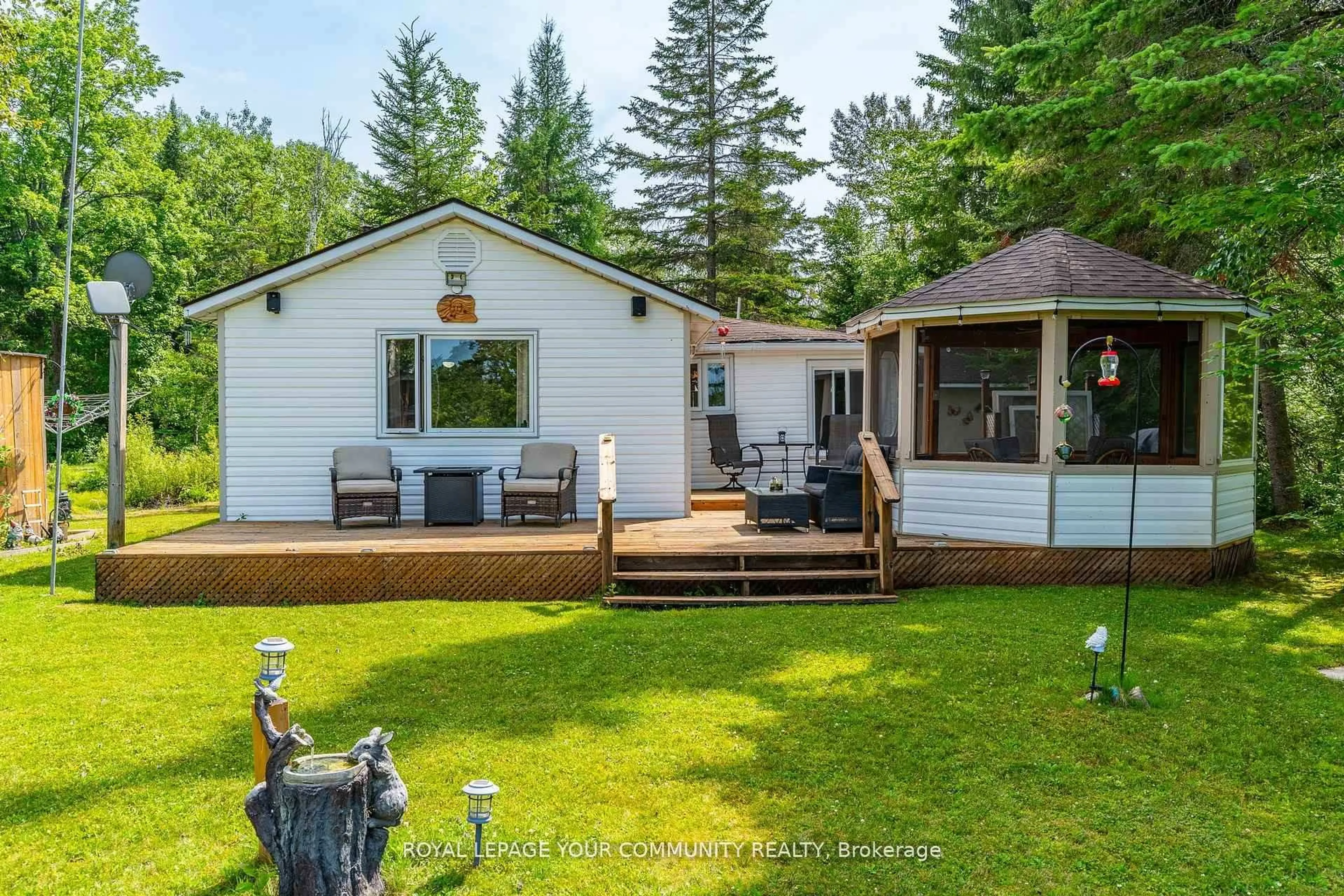 A pic from outside/outdoor area/front of a property/back of a property/a pic from drone, water/lake/river/ocean view for 1139 Canuck Tr, Minden Hills Ontario K0M 2A1