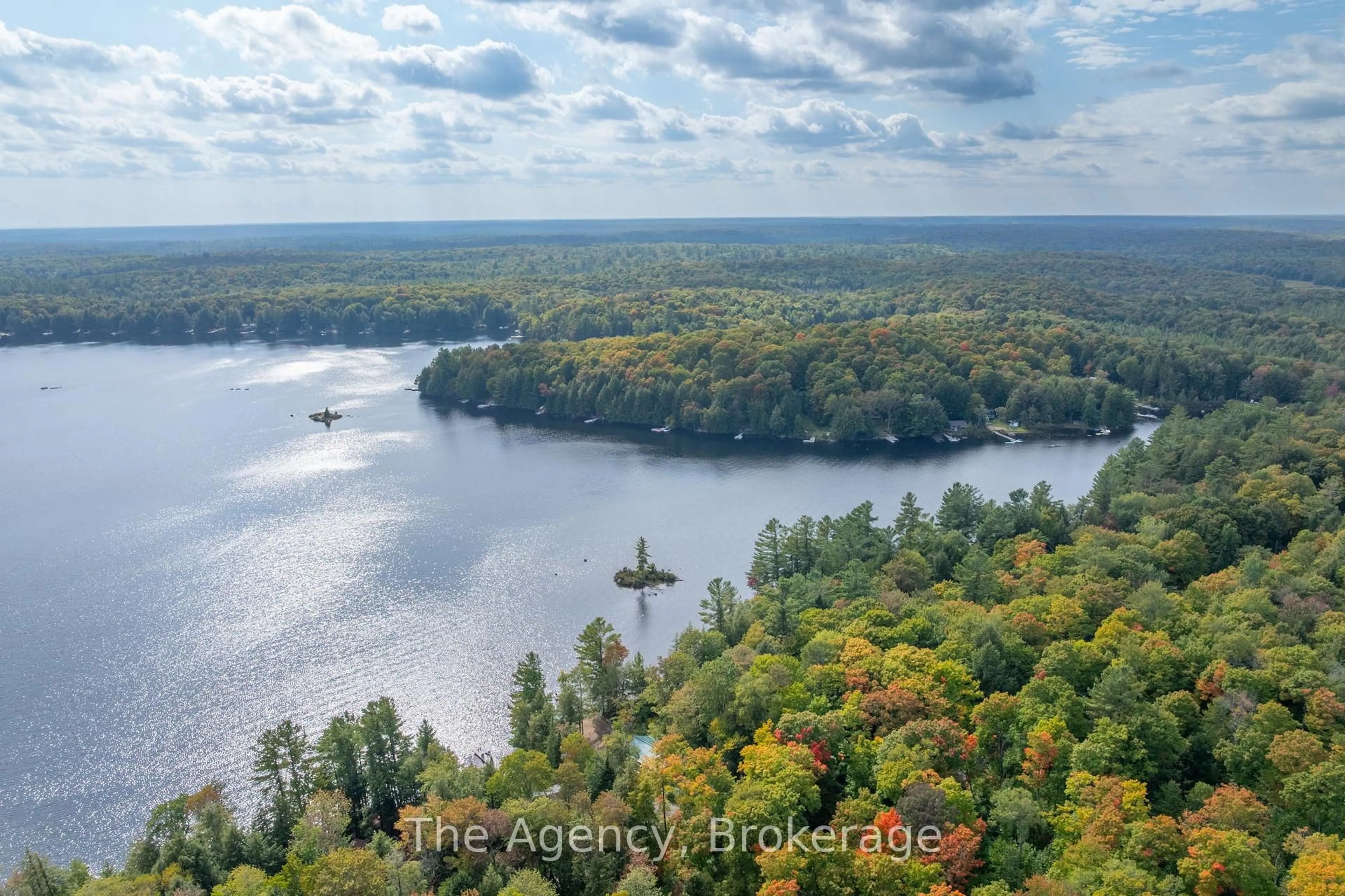 A pic from outside/outdoor area/front of a property/back of a property/a pic from drone, water/lake/river/ocean view for 1032 Lakeshore Dr, Bracebridge Ontario P1L 1X3