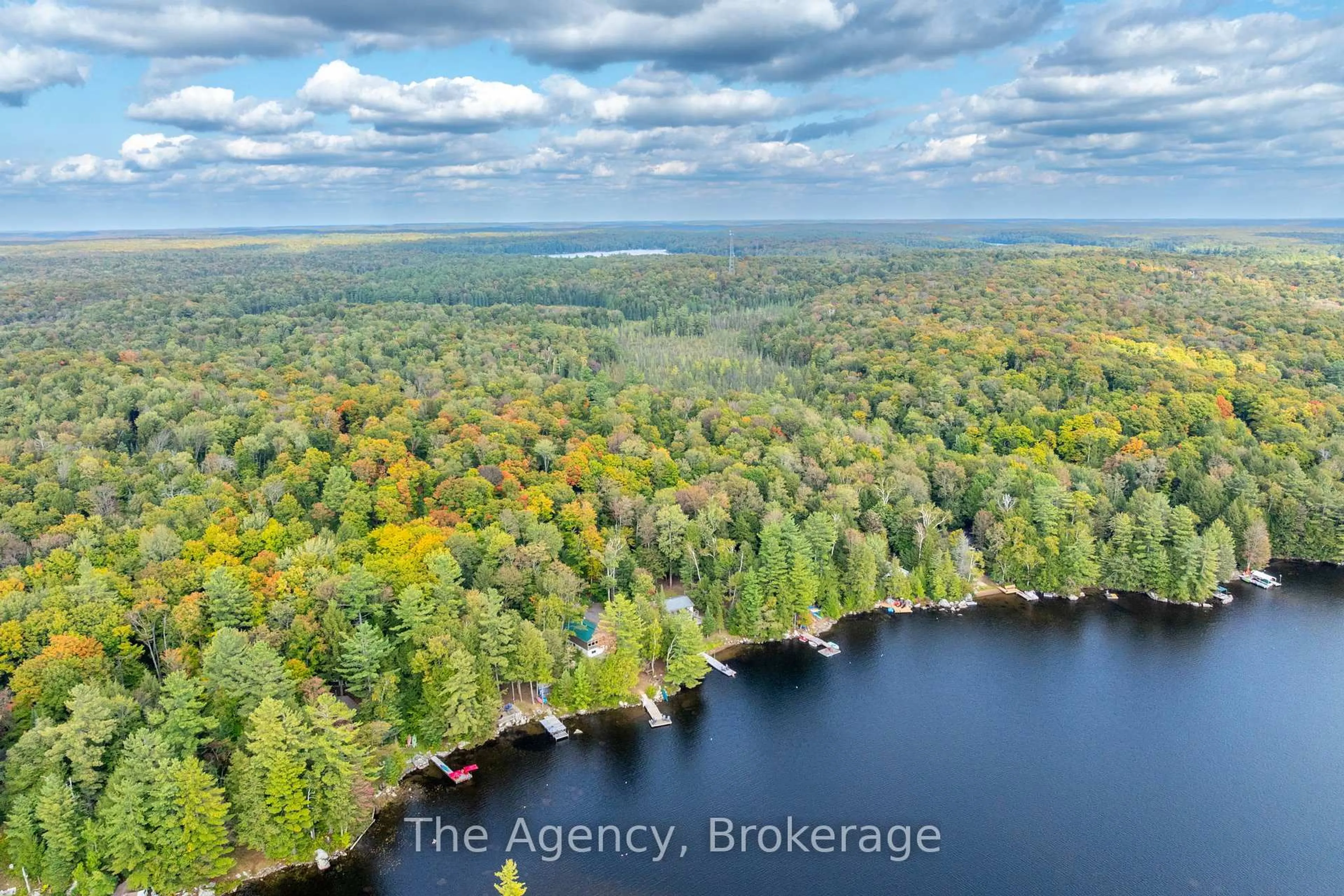 A pic from outside/outdoor area/front of a property/back of a property/a pic from drone, water/lake/river/ocean view for 1032 Lakeshore Dr, Bracebridge Ontario P1L 1X3