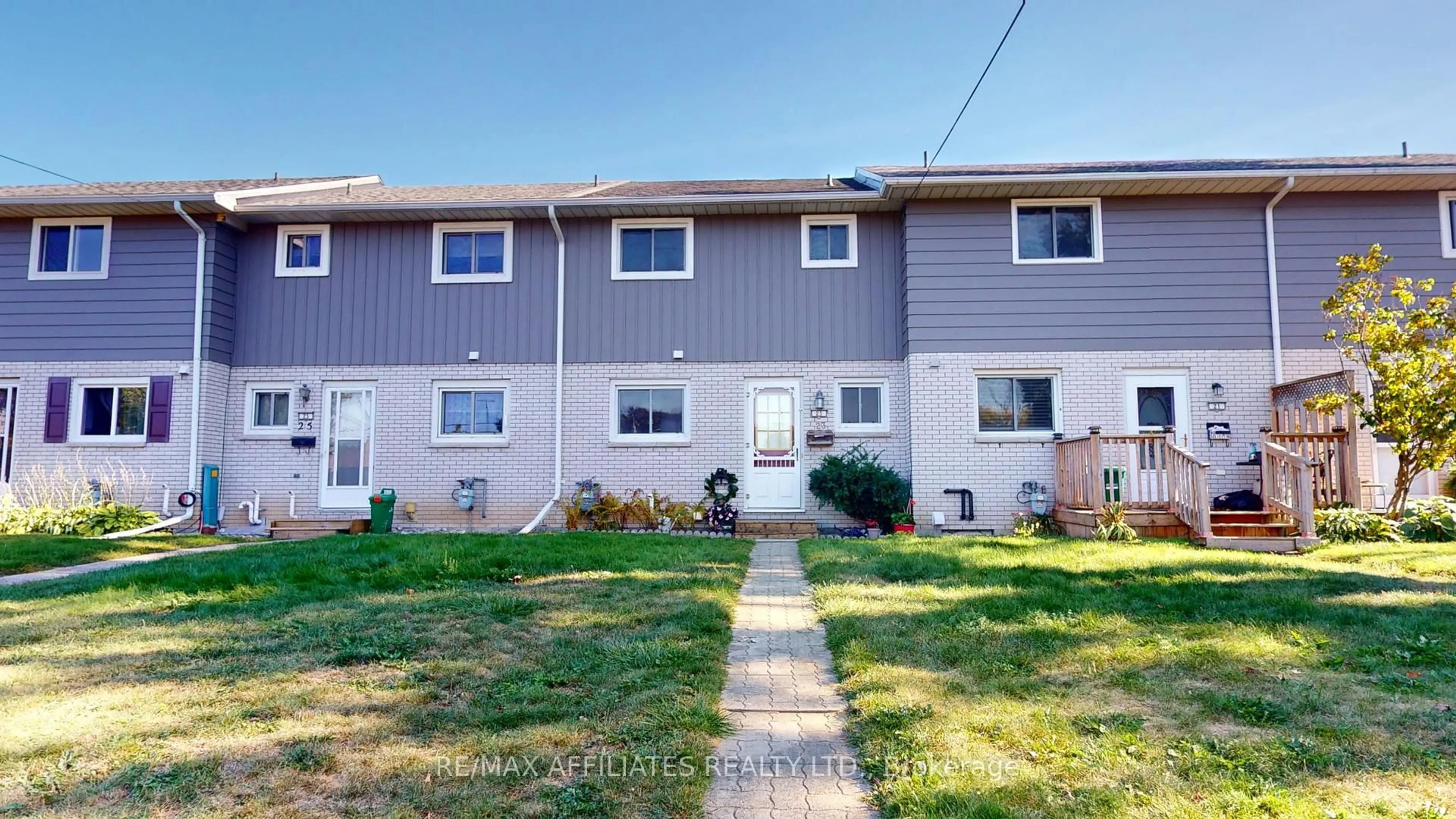 Home with vinyl exterior material, street for 23 Maple Ave, Brockville Ontario K6V 1Y3