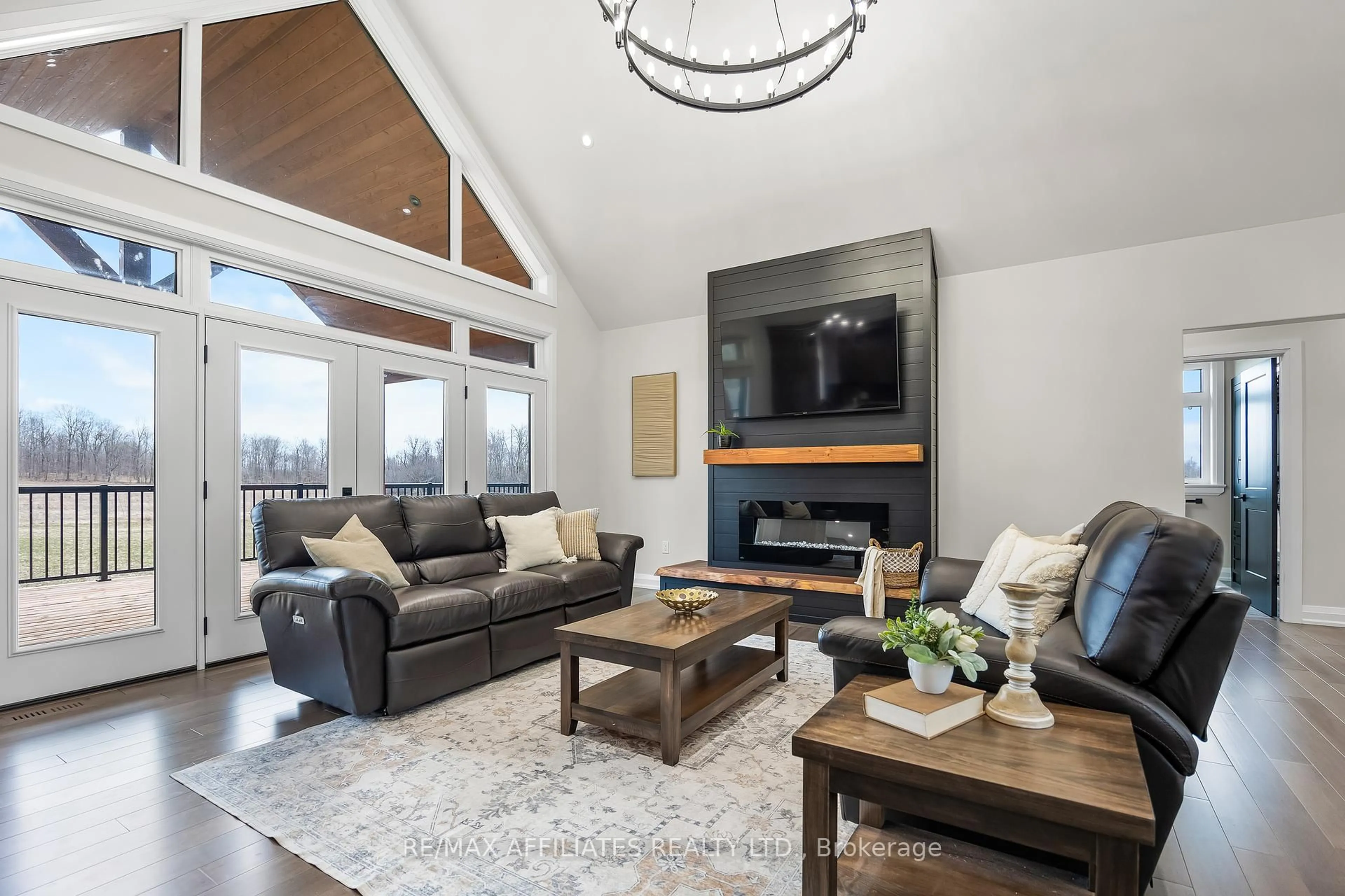 Living room with furniture, wood/laminate floor for 61 Old Kingston Rd, Rideau Lakes Ontario K0G 1L0