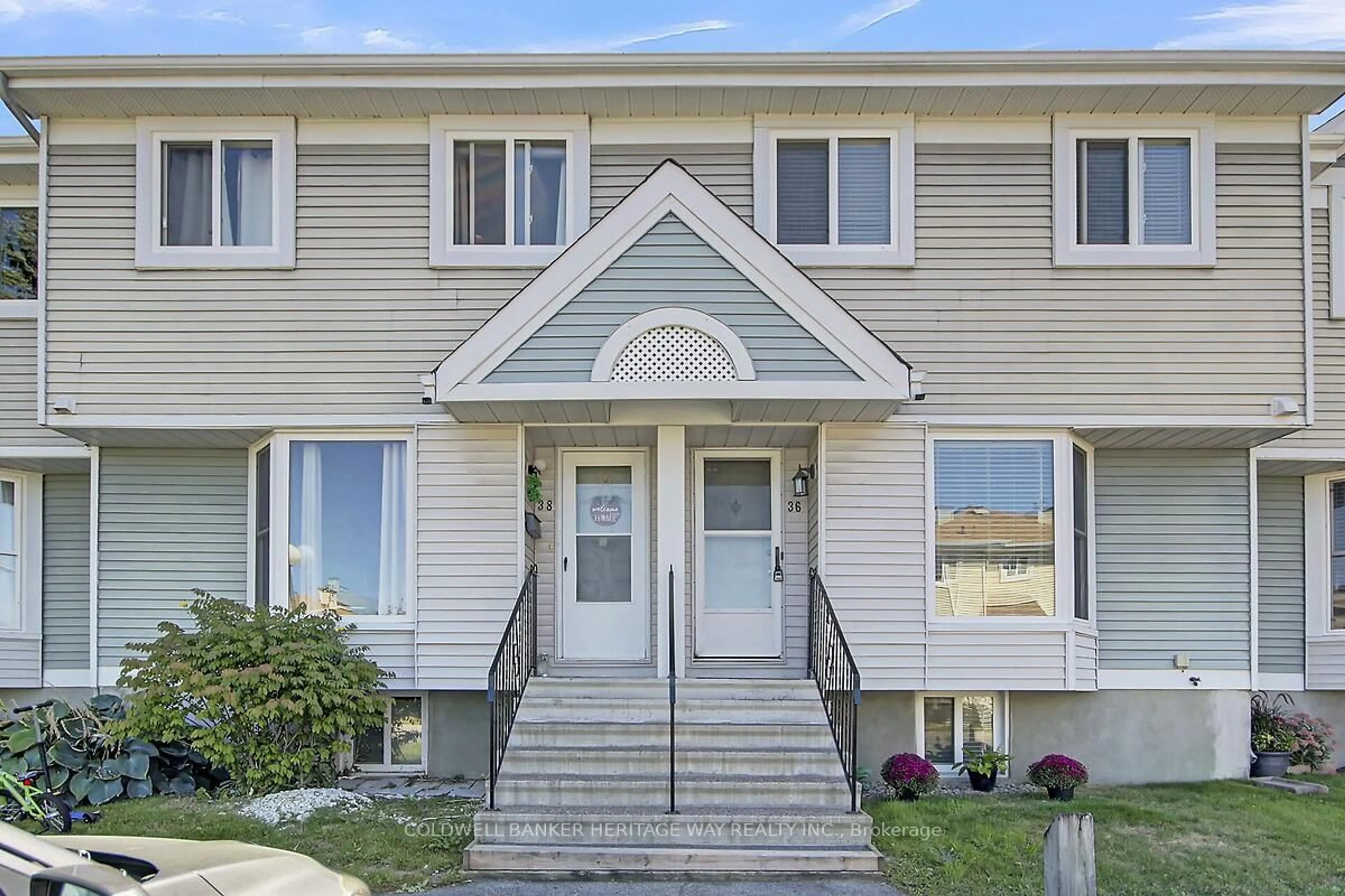 Home with vinyl exterior material, street for 36 McDermot Crt #42, Ottawa Ontario K2L 3V3