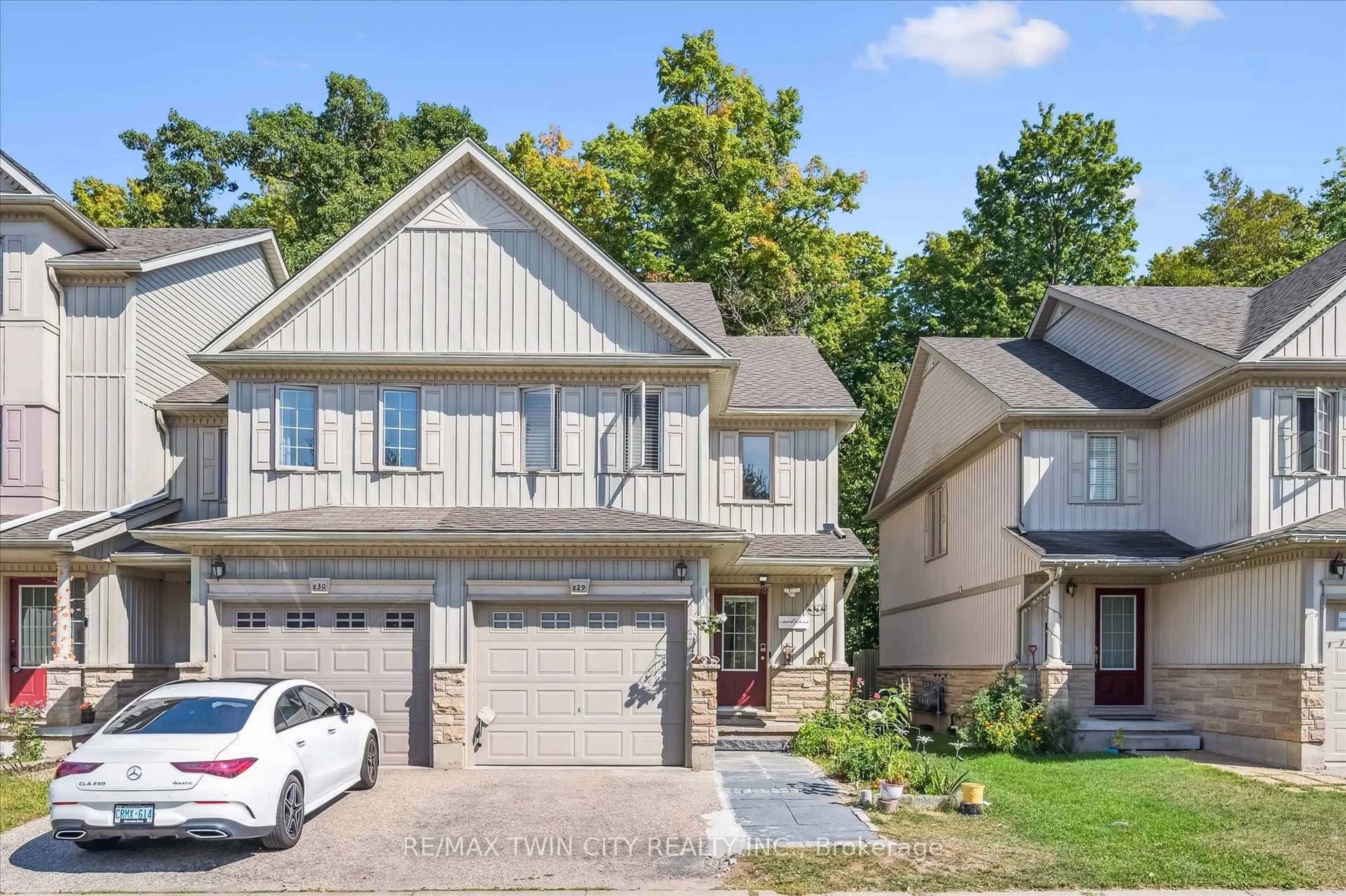 Home with brick exterior material, street for 110 Activa Ave, Kitchener Ontario N2E 3T3