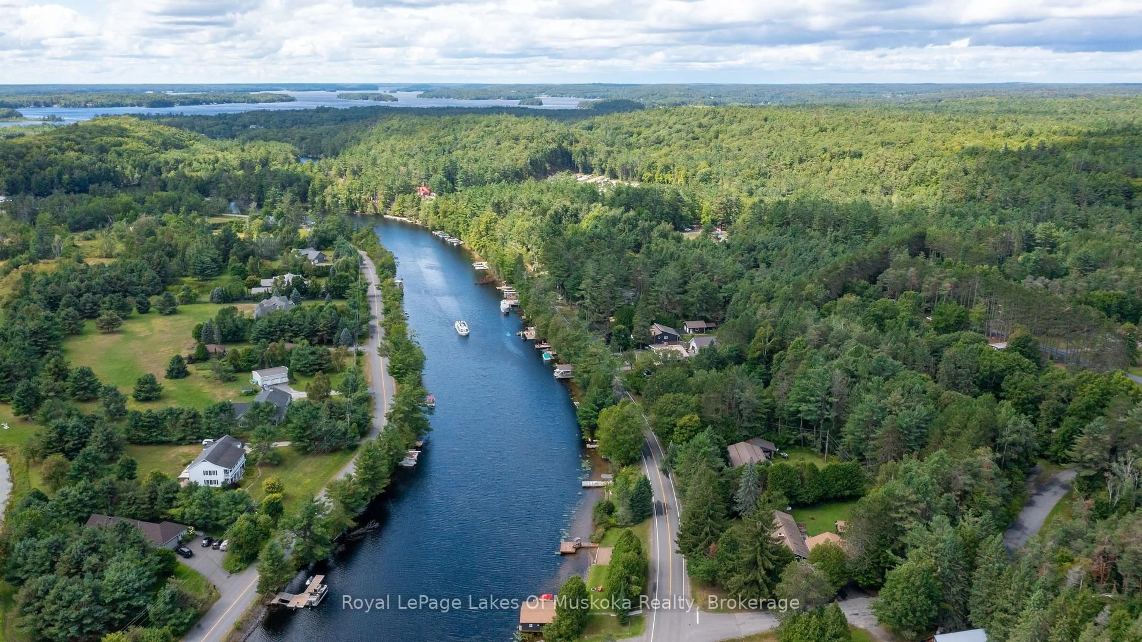 A pic from outside/outdoor area/front of a property/back of a property/a pic from drone, water/lake/river/ocean view for 2 Leslie Dr, Bracebridge Ontario P1L 1W8