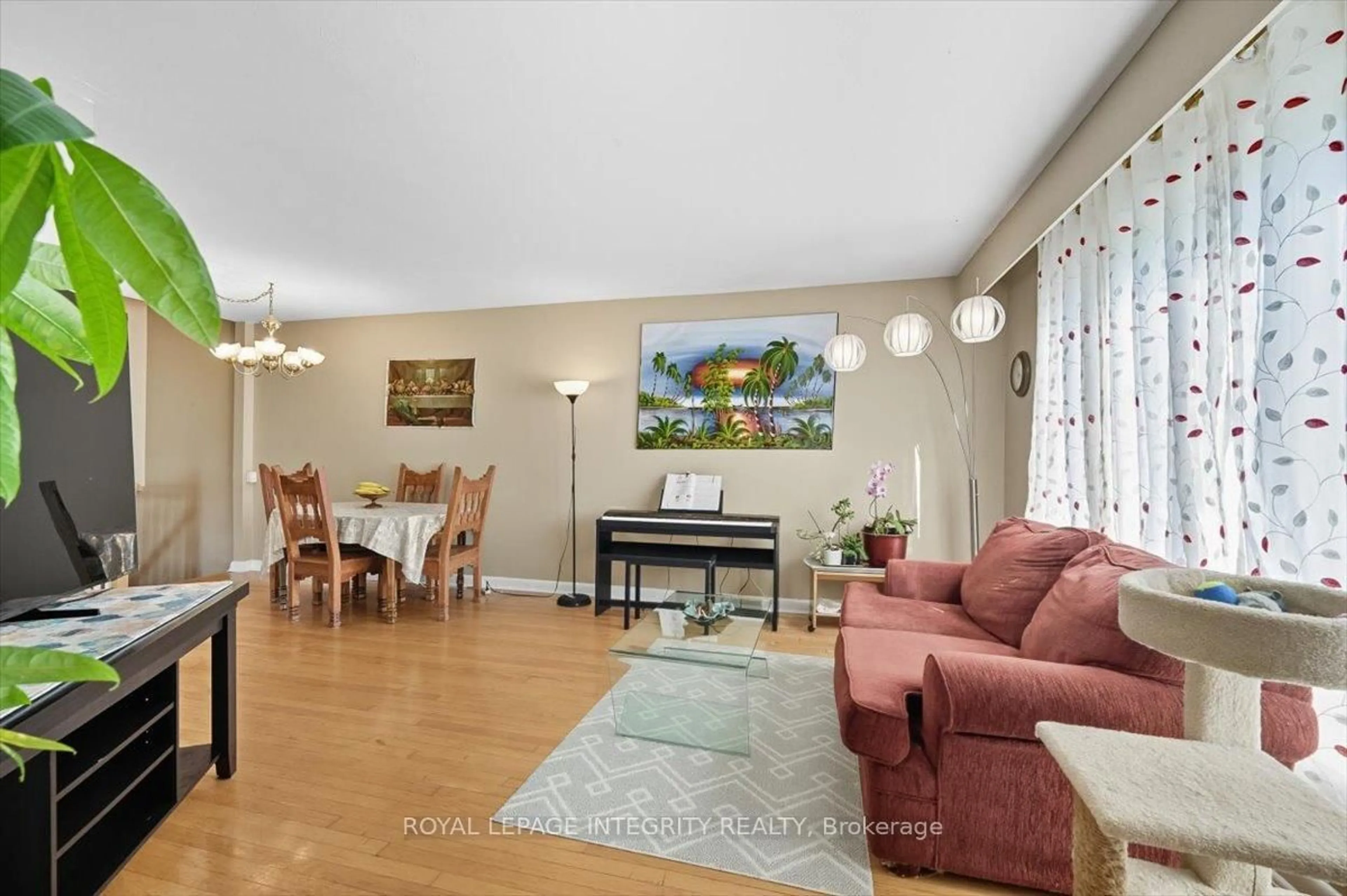 Living room with furniture, wood/laminate floor for 1293 Maitland Ave, Ottawa Ontario K2C 2C4