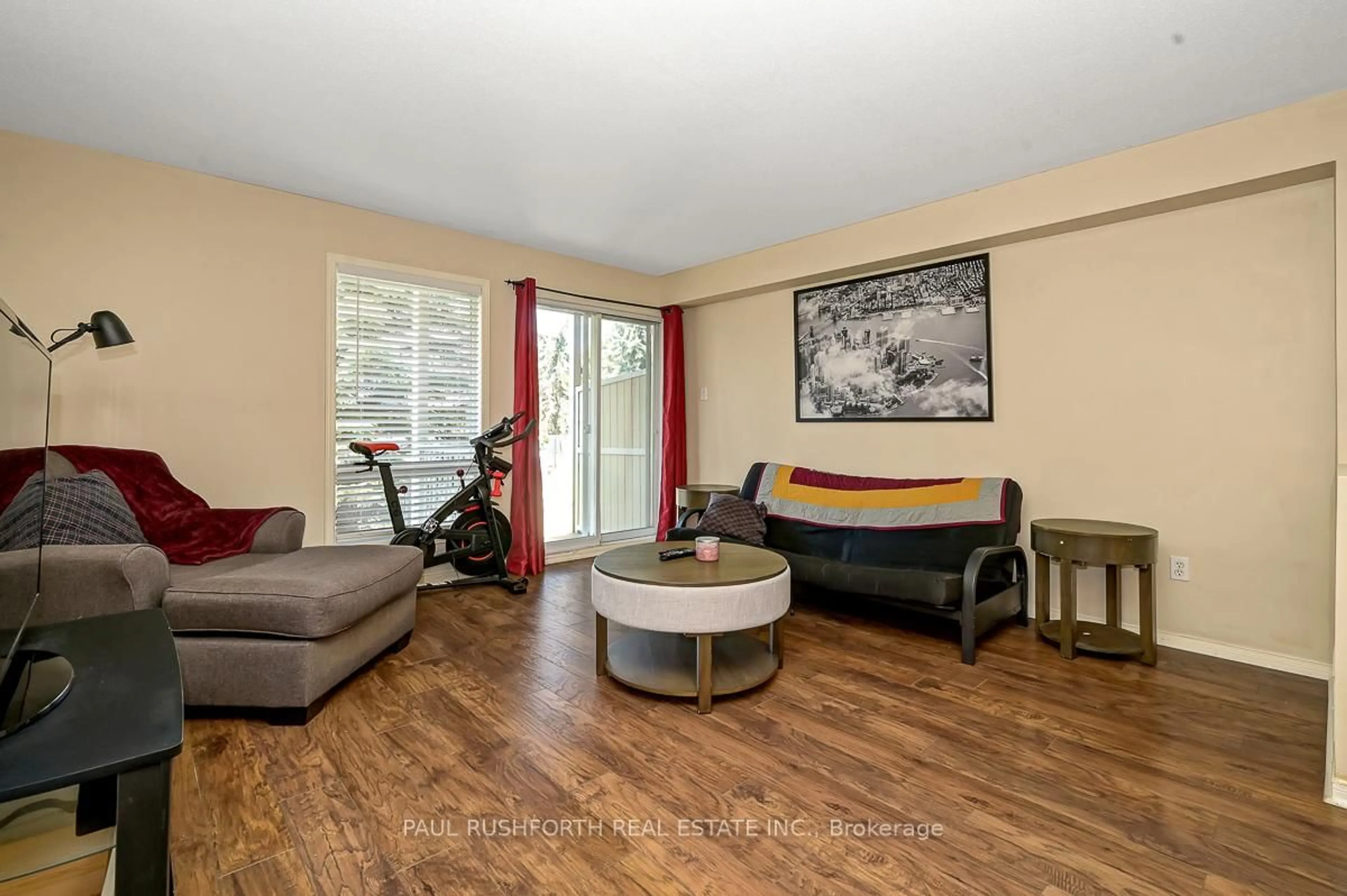 Living room with furniture, wood/laminate floor for 2224 Bois Vert Pl, Ottawa Ontario K4A 4T7