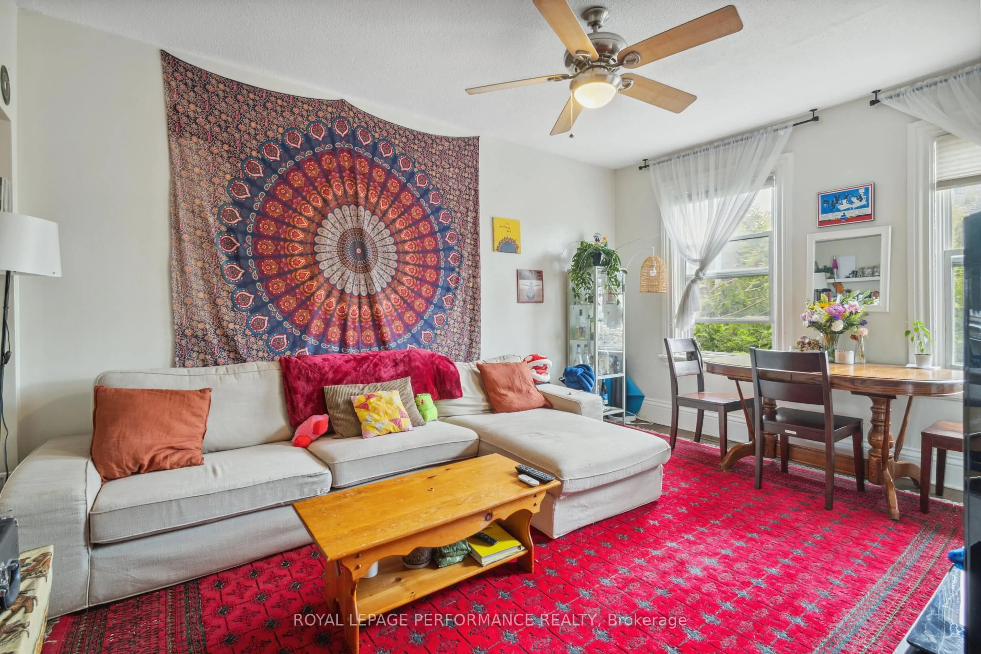 Living room with furniture, carpet floor for 76-78-80 Cambridge St, Ottawa Ontario K1R 7A7