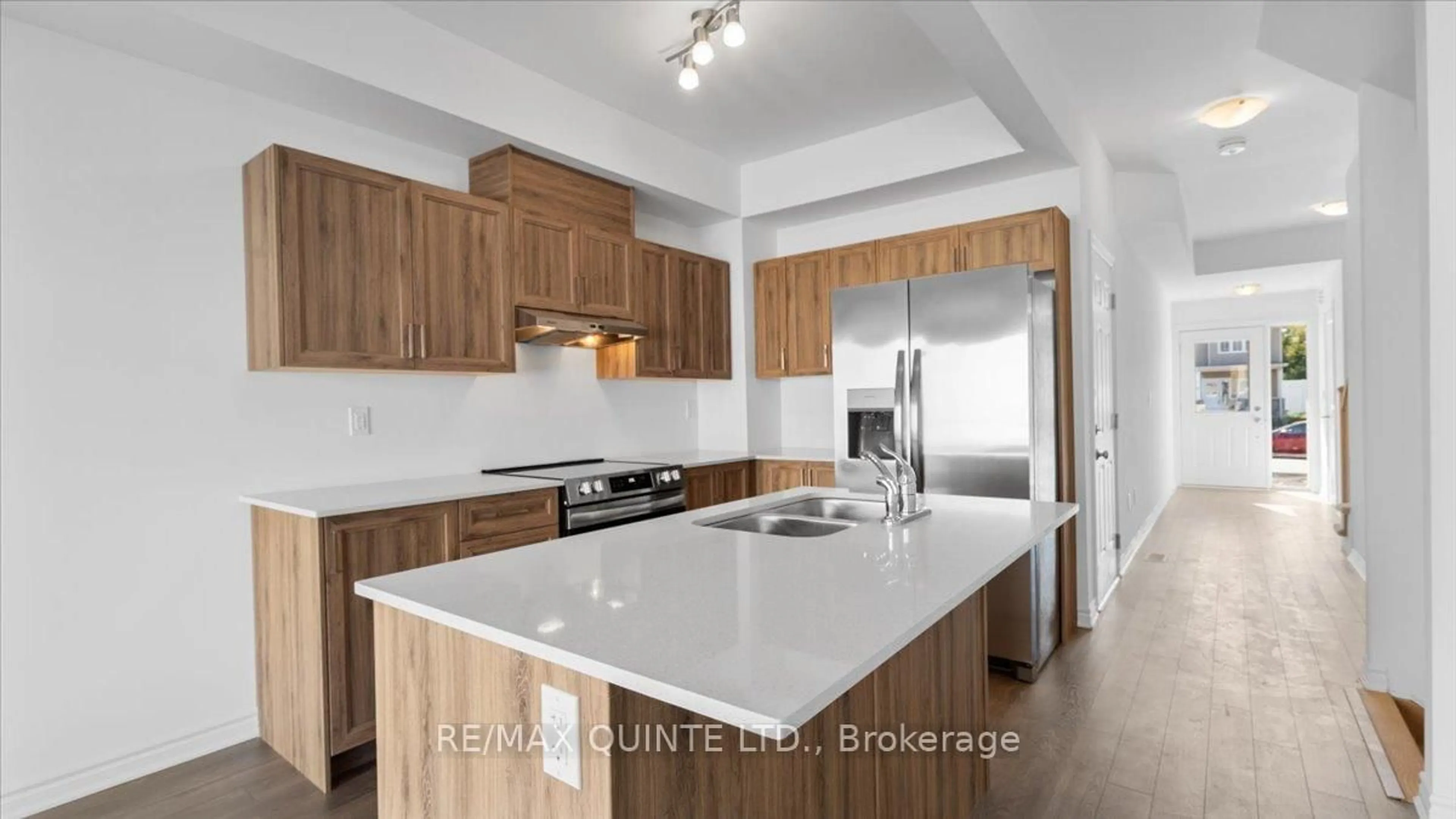 Open concept kitchen, wood/laminate floor for 53 Lincoln Dr, Belleville Ontario K8N 0T7