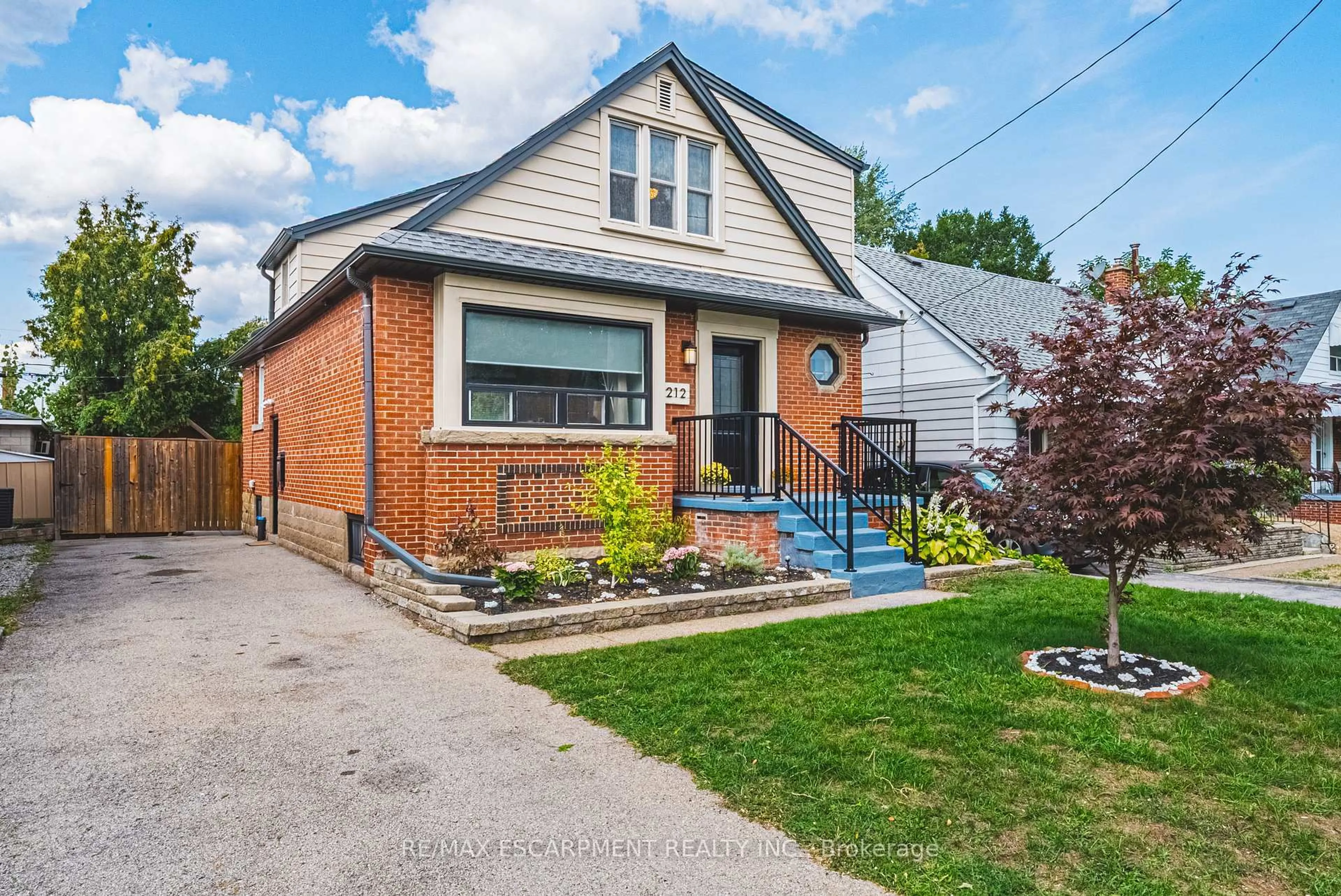 Home with brick exterior material, street for 212 Rodgers Rd, Hamilton Ontario L8K 3C4