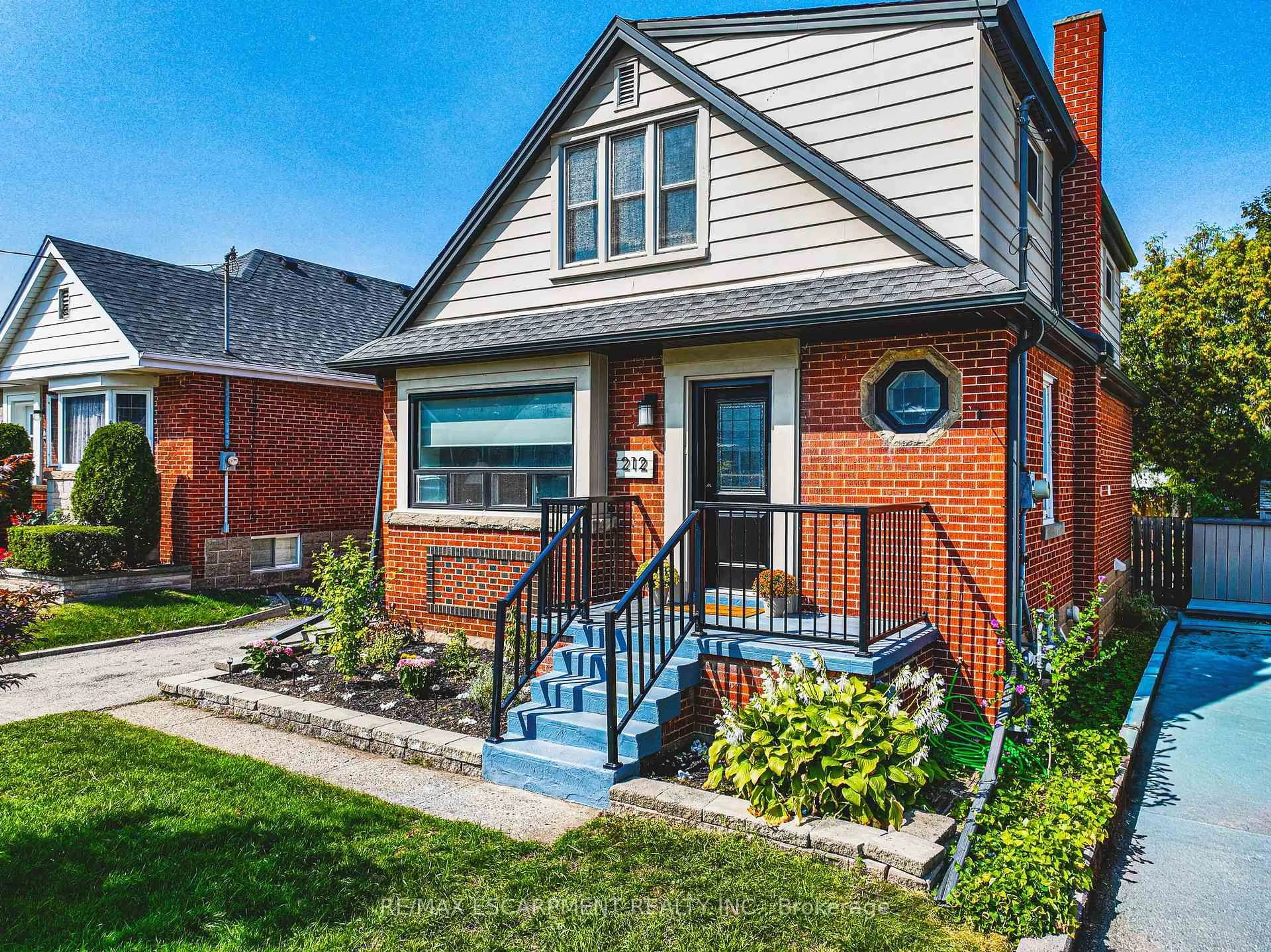 Home with brick exterior material, street for 212 Rodgers Rd, Hamilton Ontario L8K 3C4
